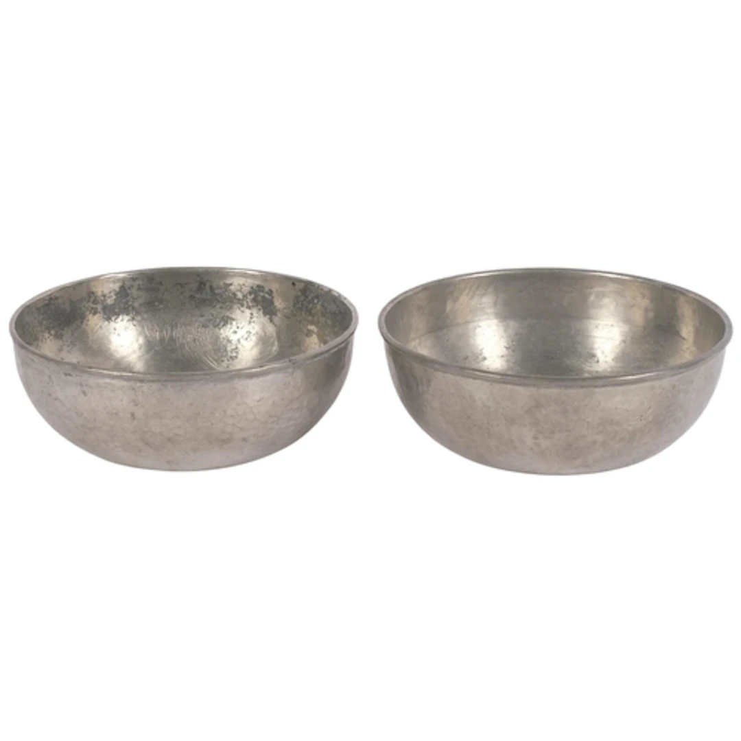 A pair of Tudric for Liberty hand-beaten pewter dishes, diam...