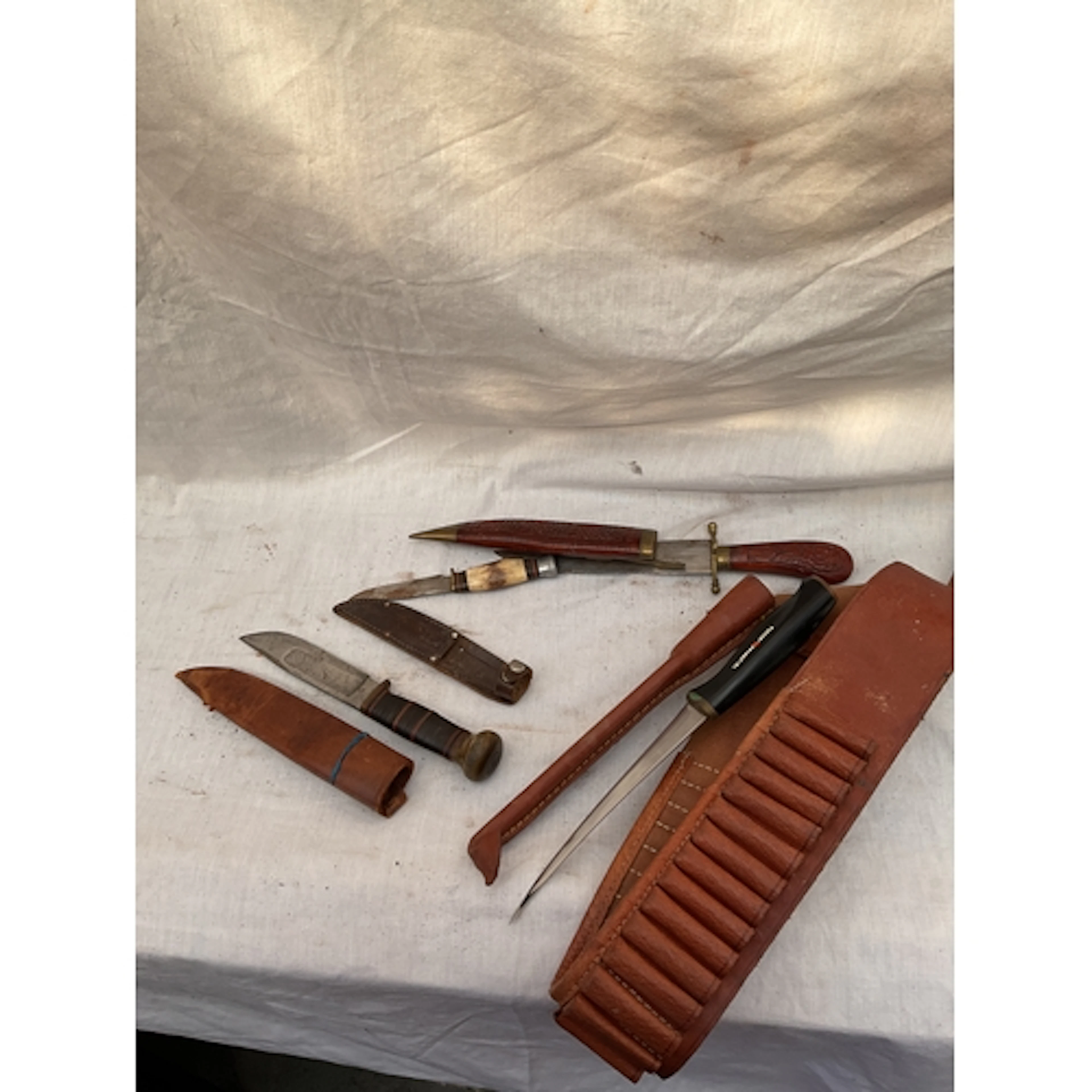 Four knives to inc ammo belt and Fiskard skinning knife.