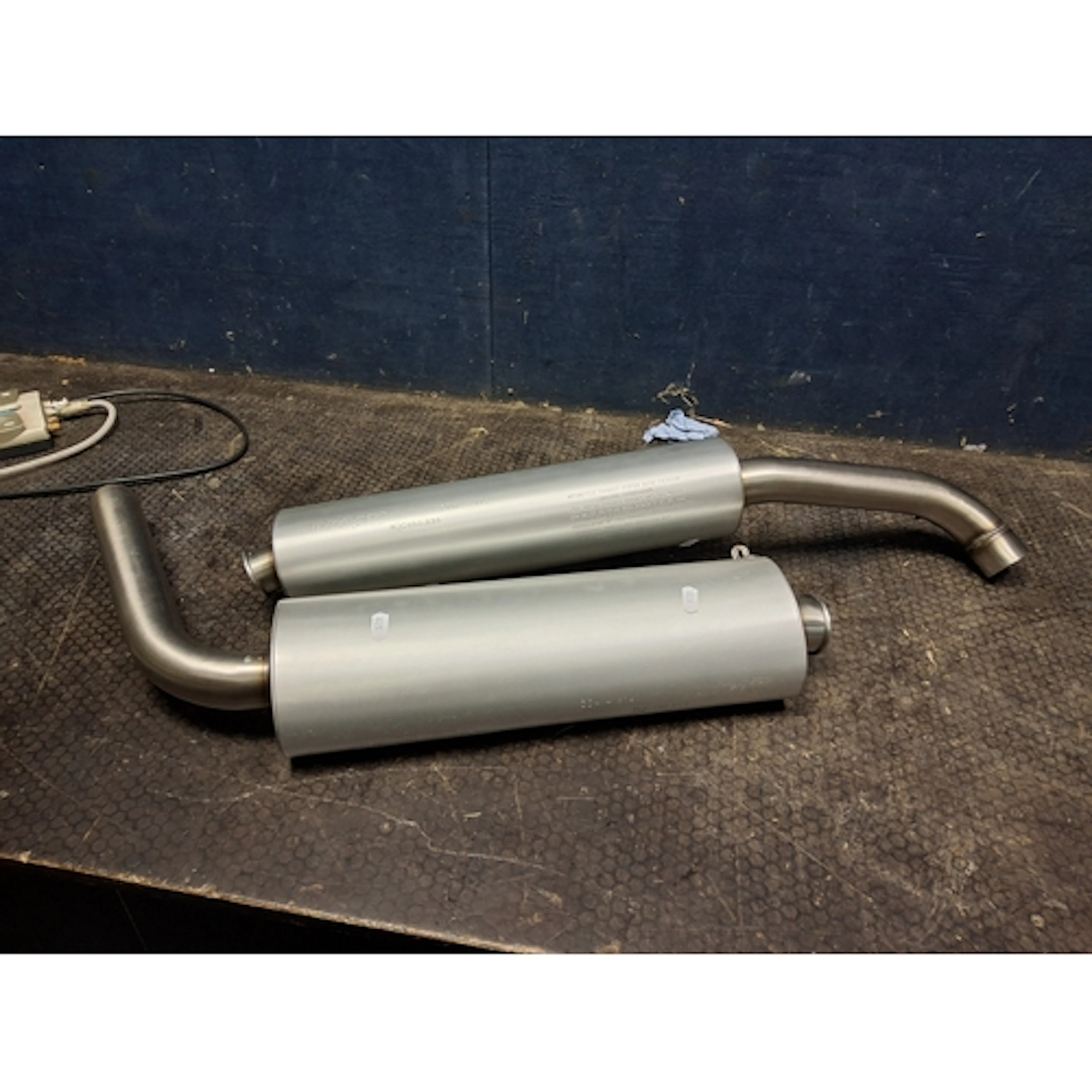 A PAIR OF DUCATI MOTORCYCLE EXHAUST SILENCERS, stamped ZDM-A...