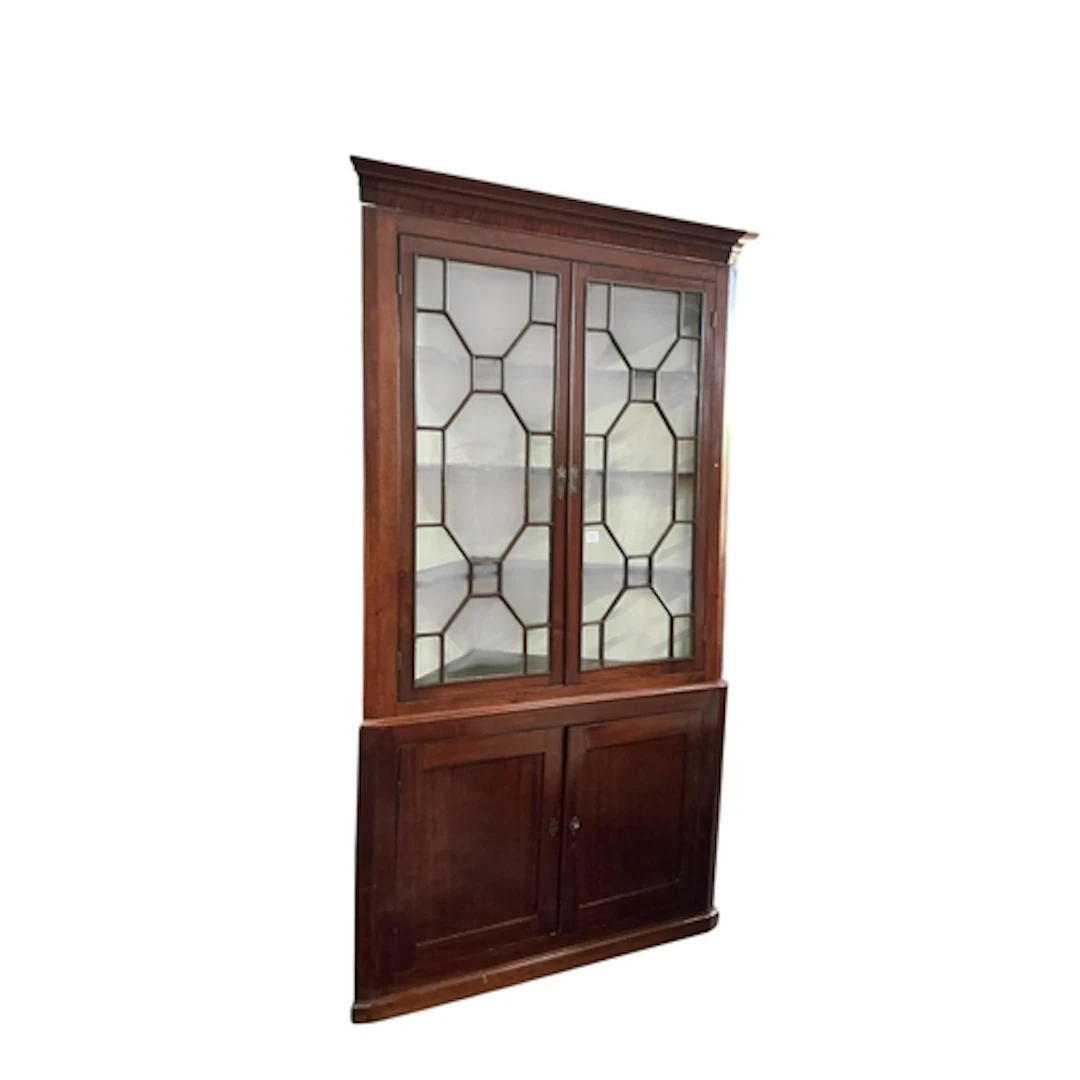 A George III mahogany standing corner cupboard, width 127cm,...
