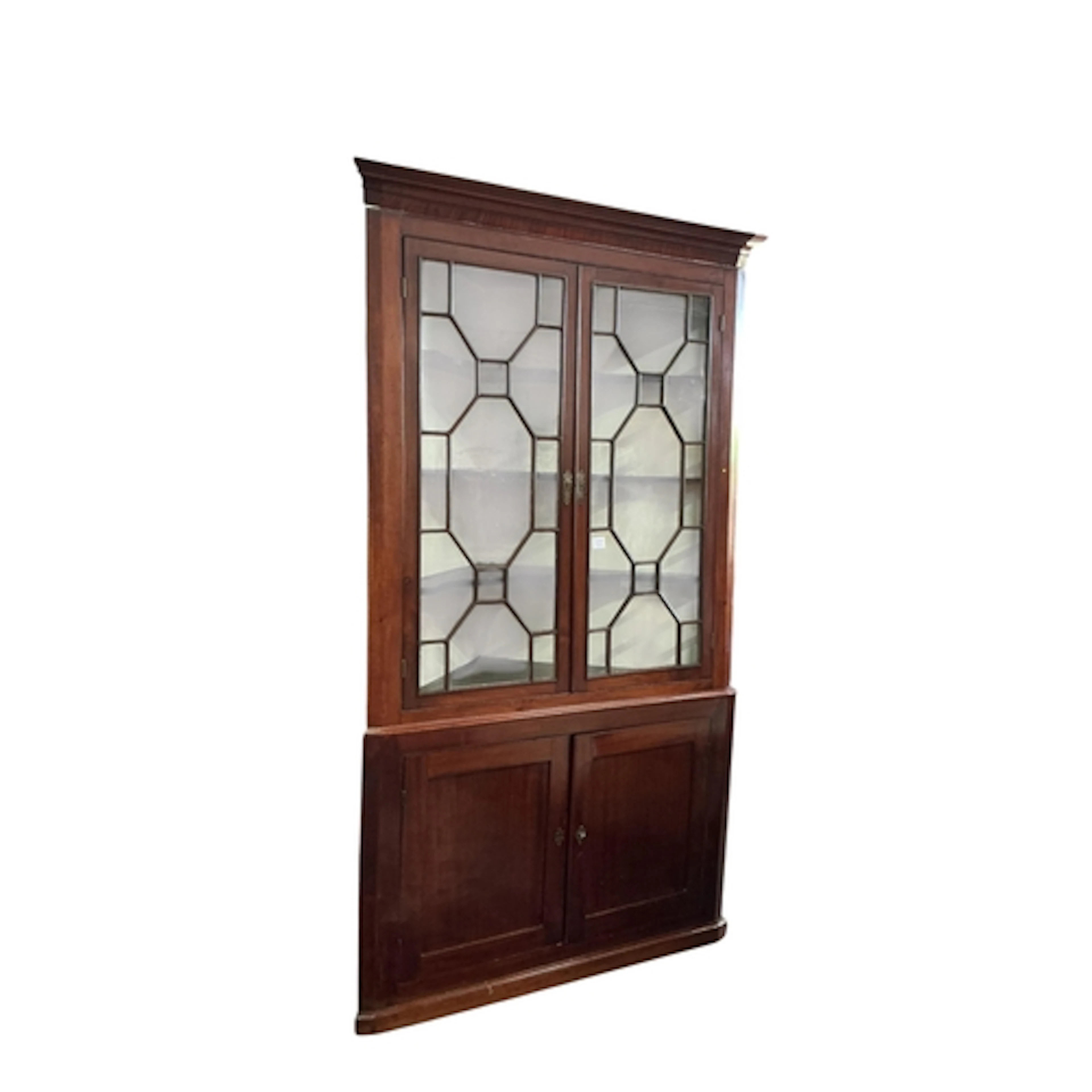 A George III mahogany standing corner cupboard, width 127cm,...