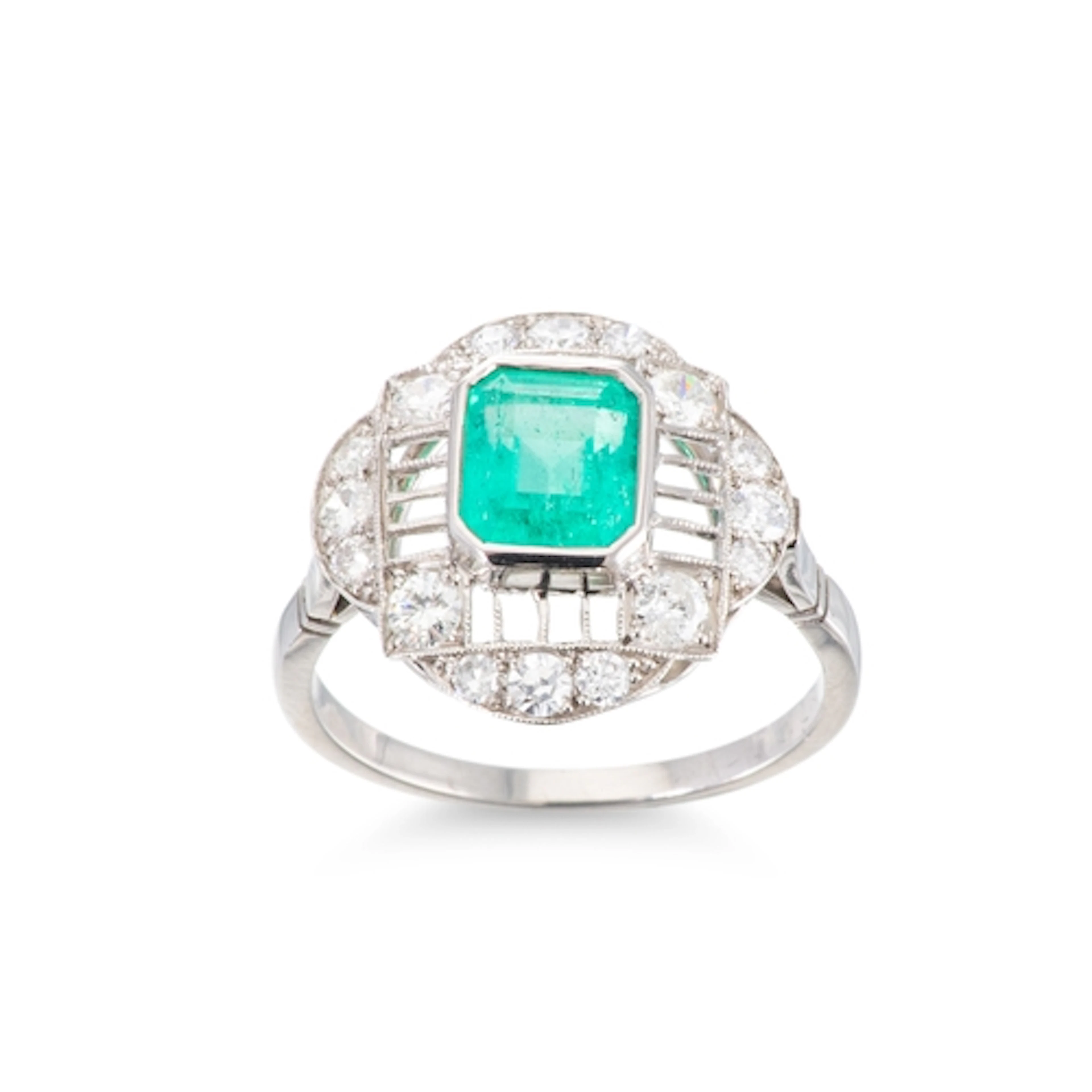 AN ART DECO STYLE EMERALD AND DIAMOND CLUSTER RING, the cent...