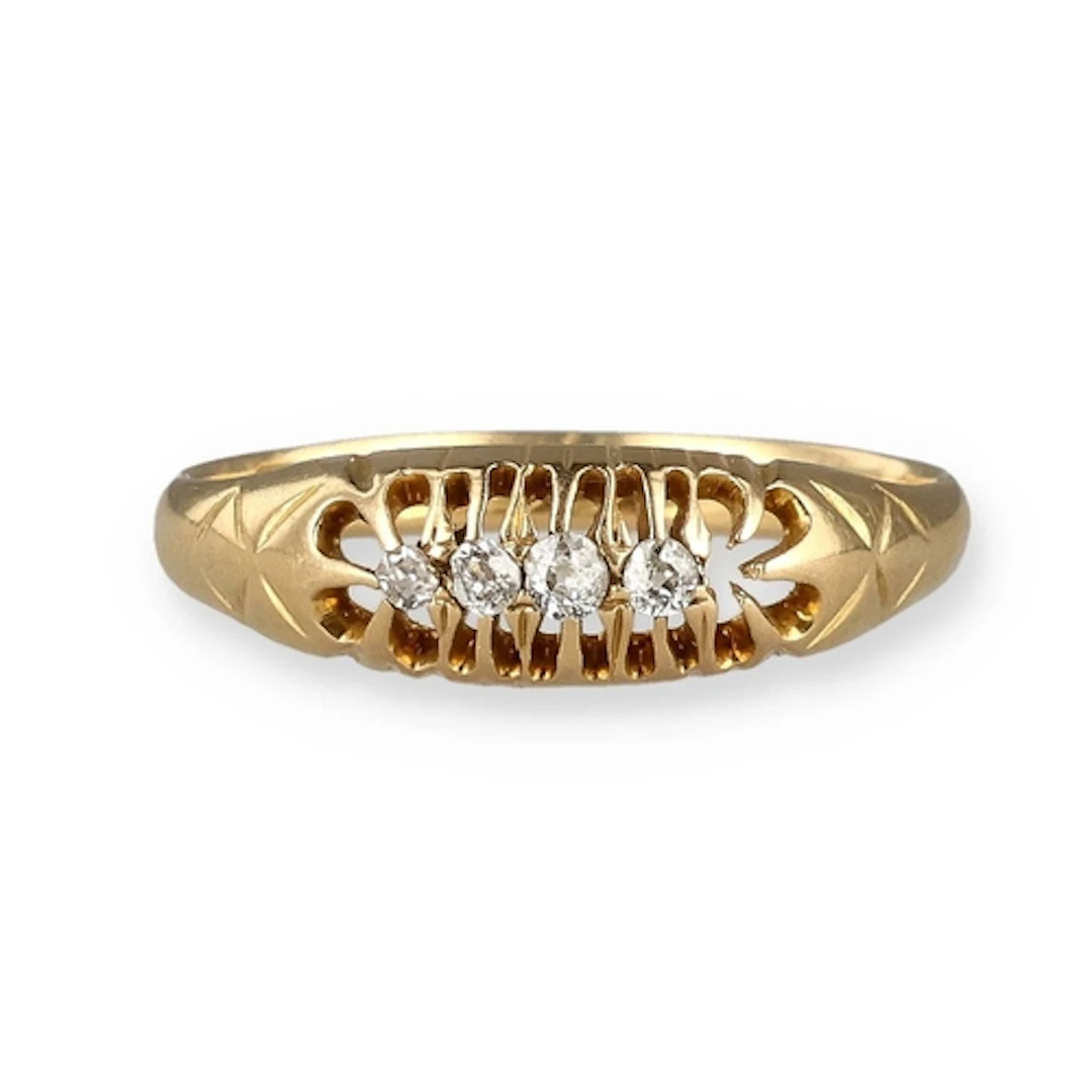 AN 18CT GOLD FOUR STONE DIAMOND RING Weight: 2.3gms...