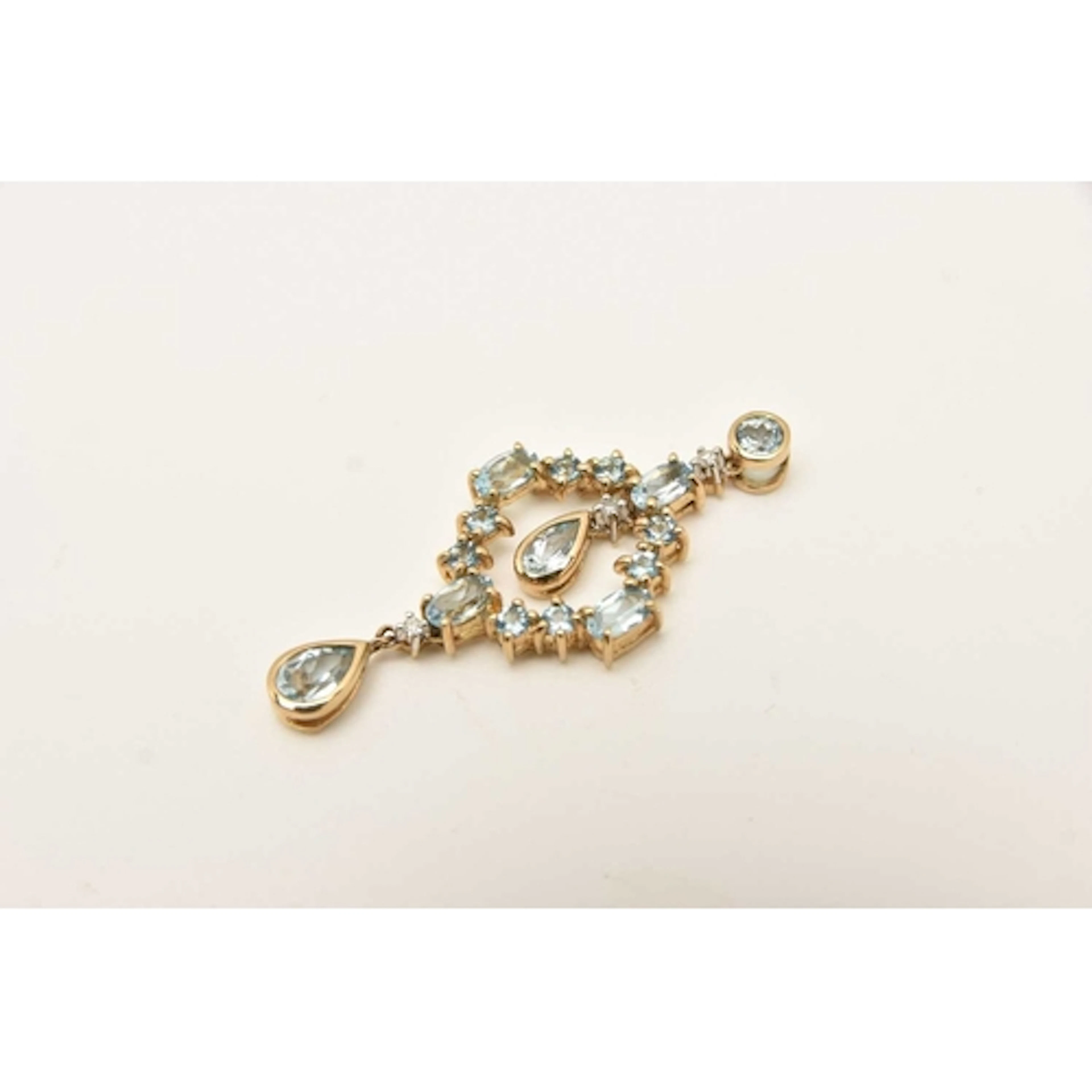 A 9CT YELLOW GOLD GEM SET PENDANT, open work drop pendant se...