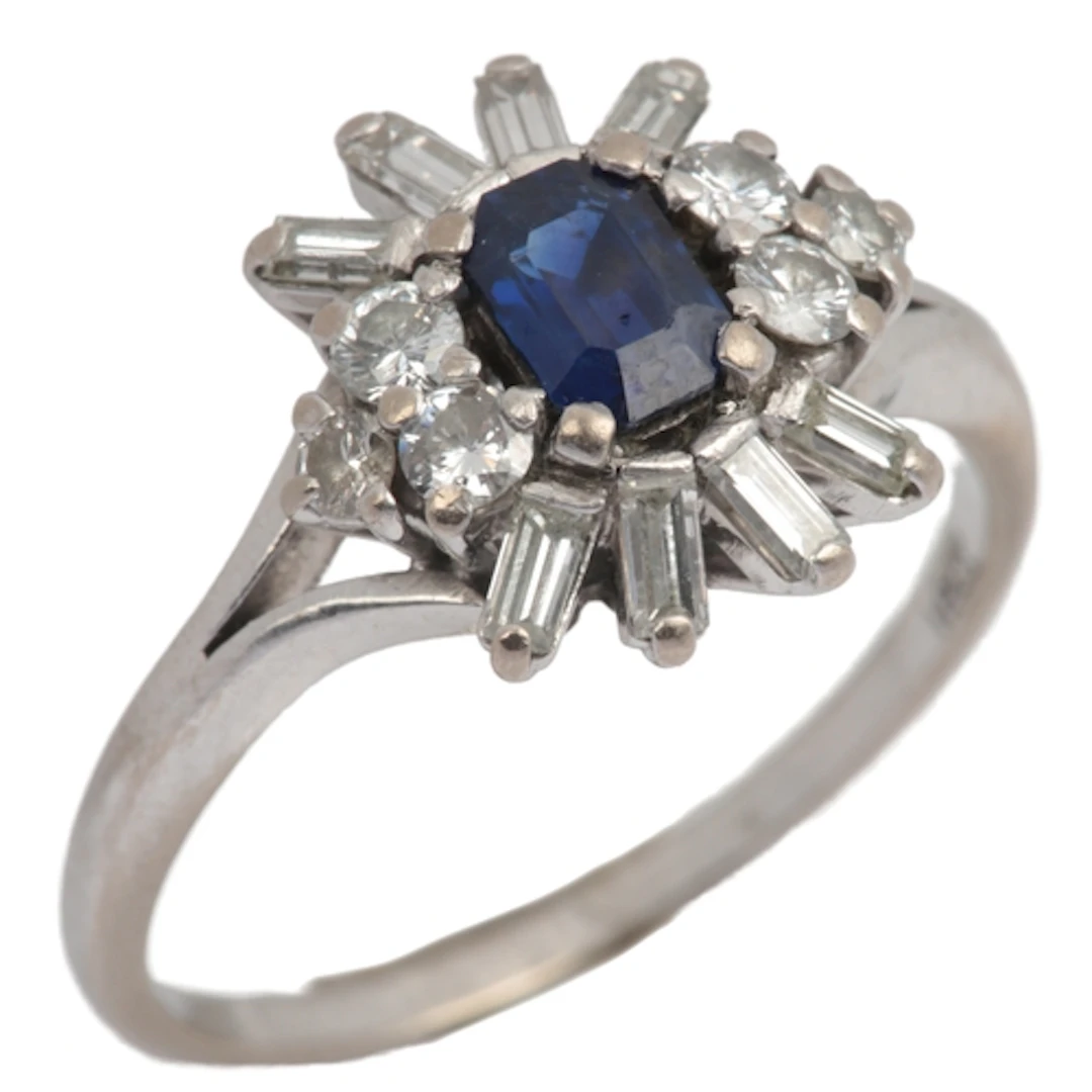 A sapphire and diamond ring, mid 20th century, claw-set with...