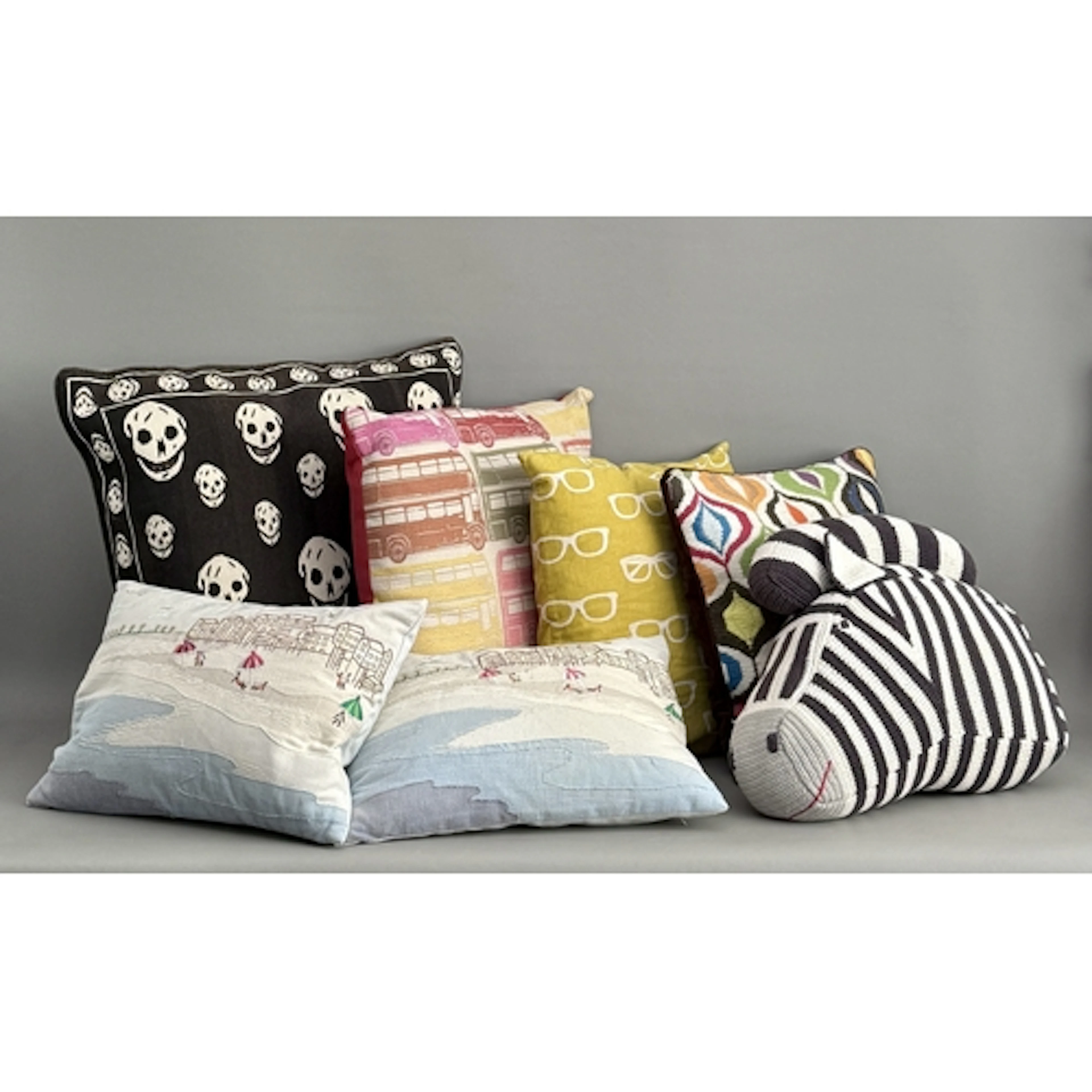 Seven scatter cushions including Alexander McQueen kelim sty...
