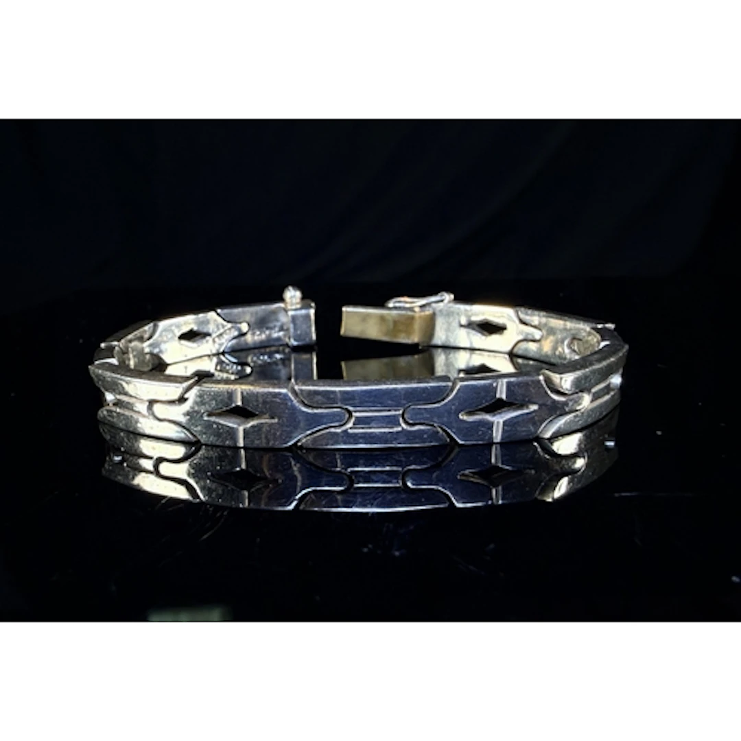 A white metal Aztec style link bracelet stamped 925 MEX, 37g...