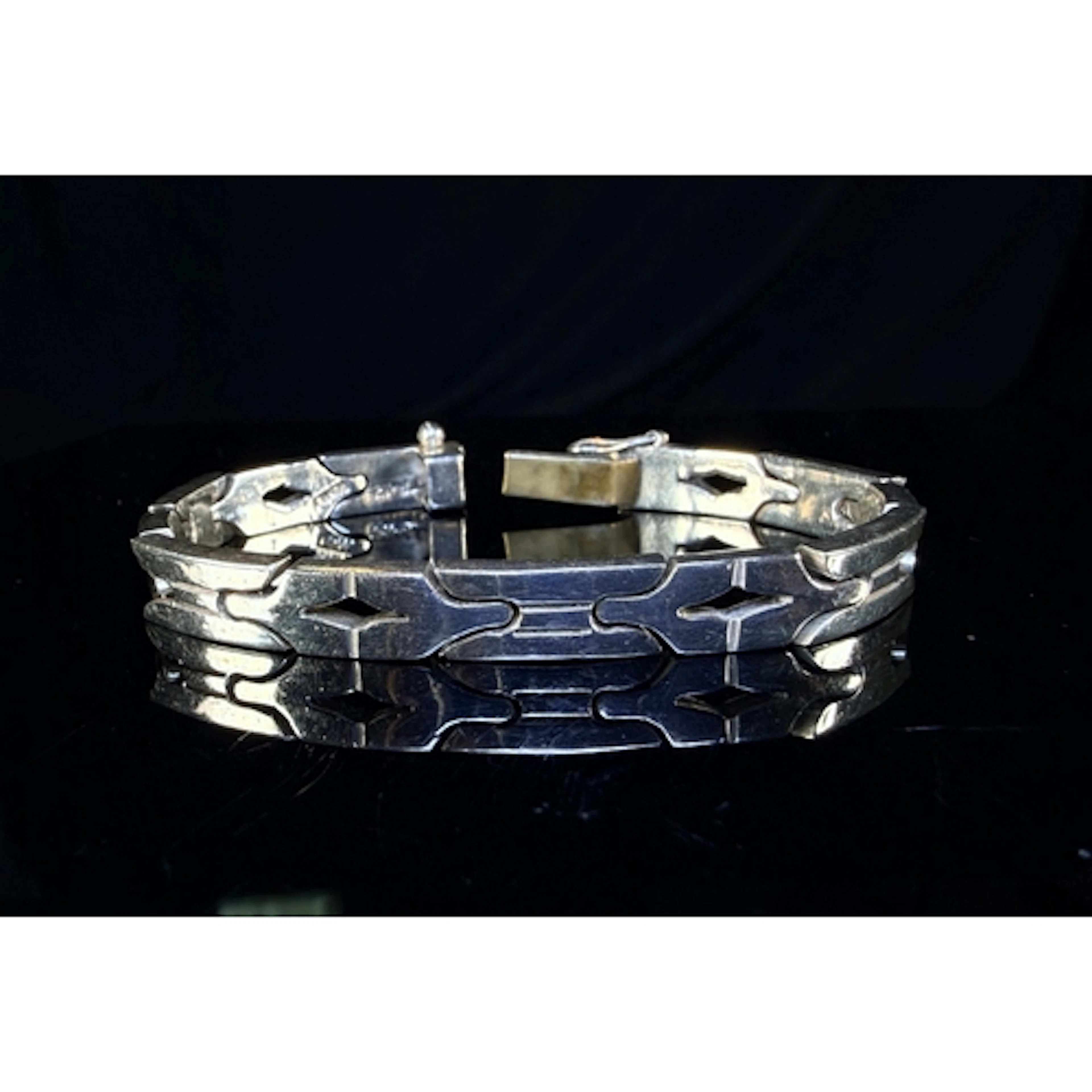 A white metal Aztec style link bracelet stamped 925 MEX, 37g...