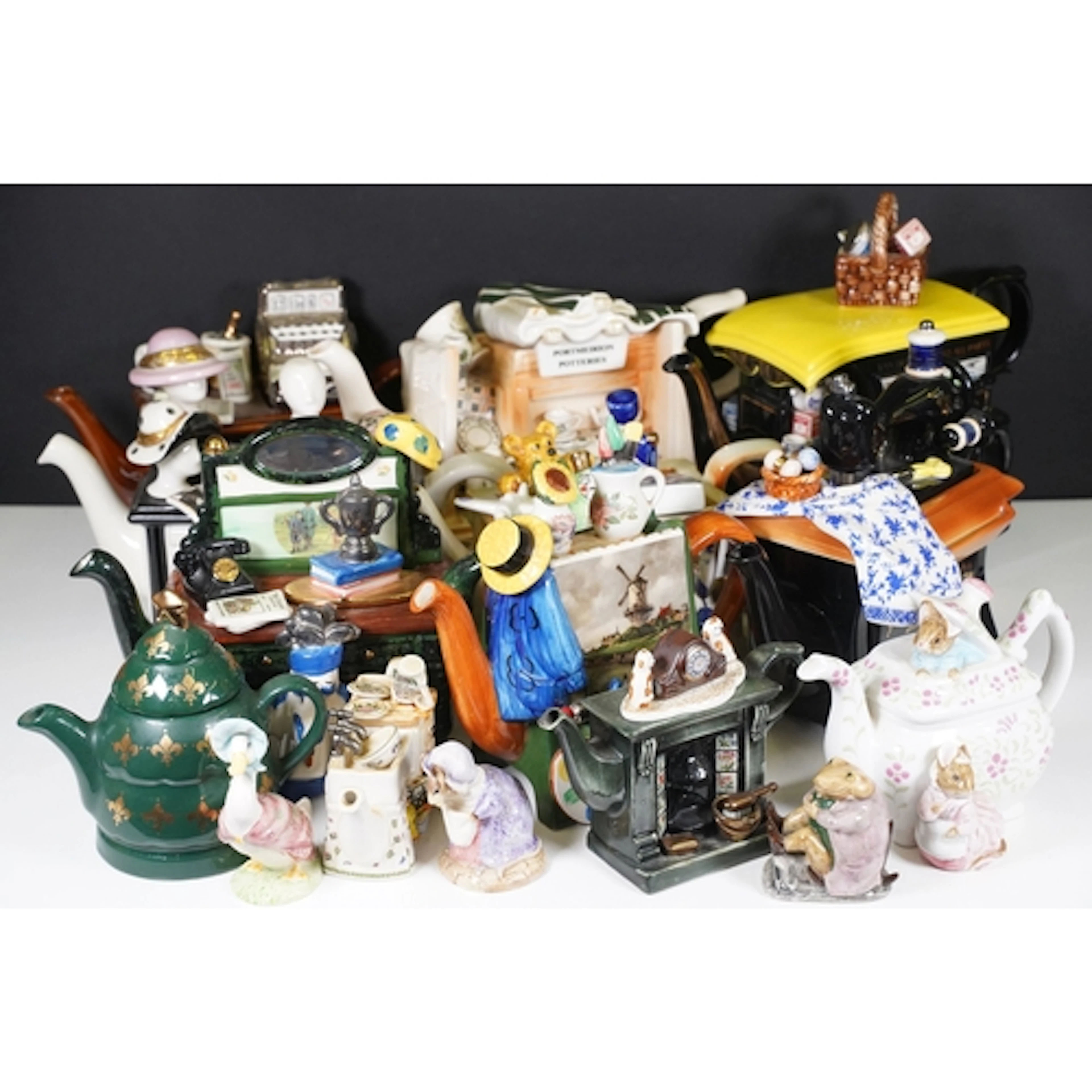Tony Carter novelty teapots to include 'Golf' and 'Vogue', m...