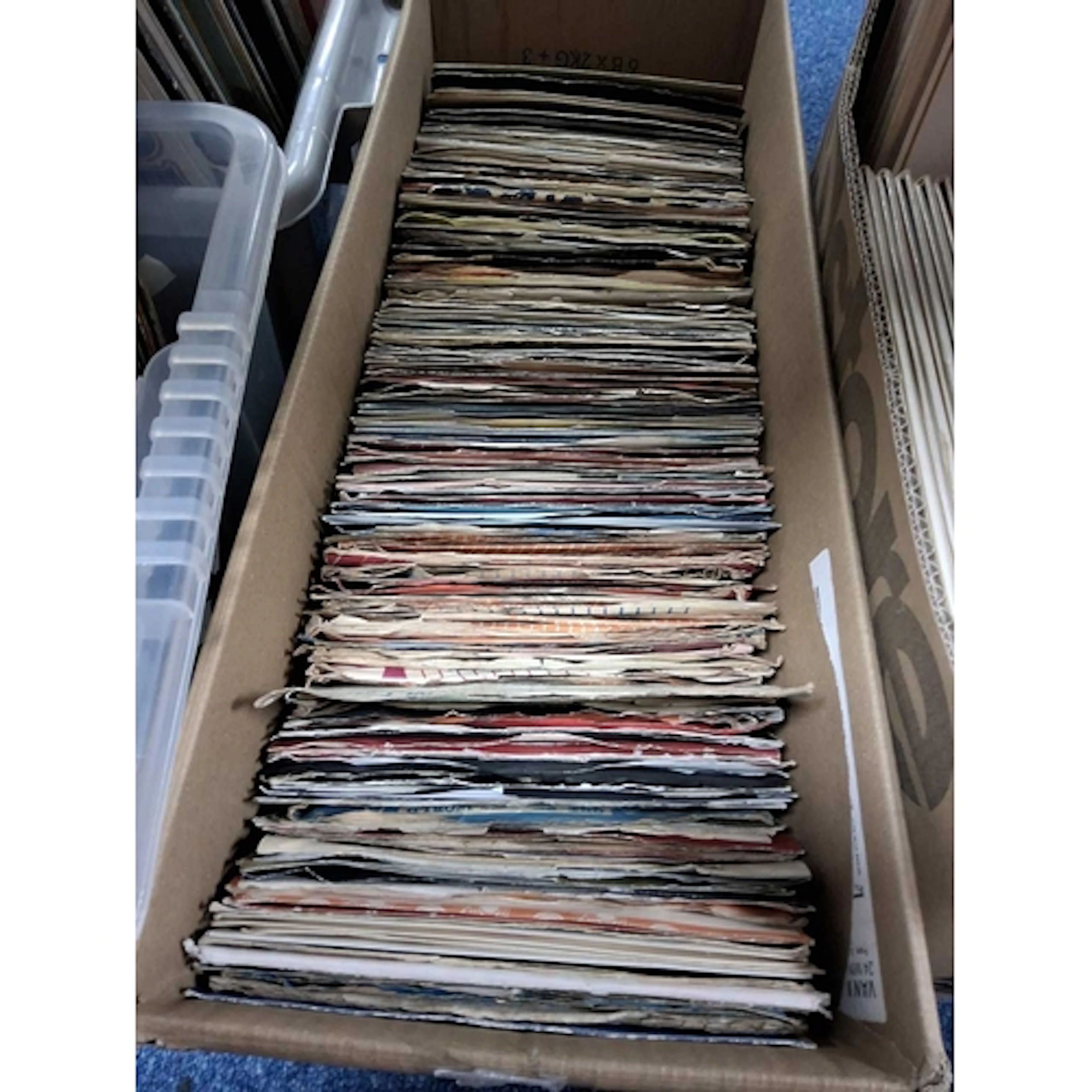 A BOX OF VINYL SINGLES, approximately one hundred and eighty...