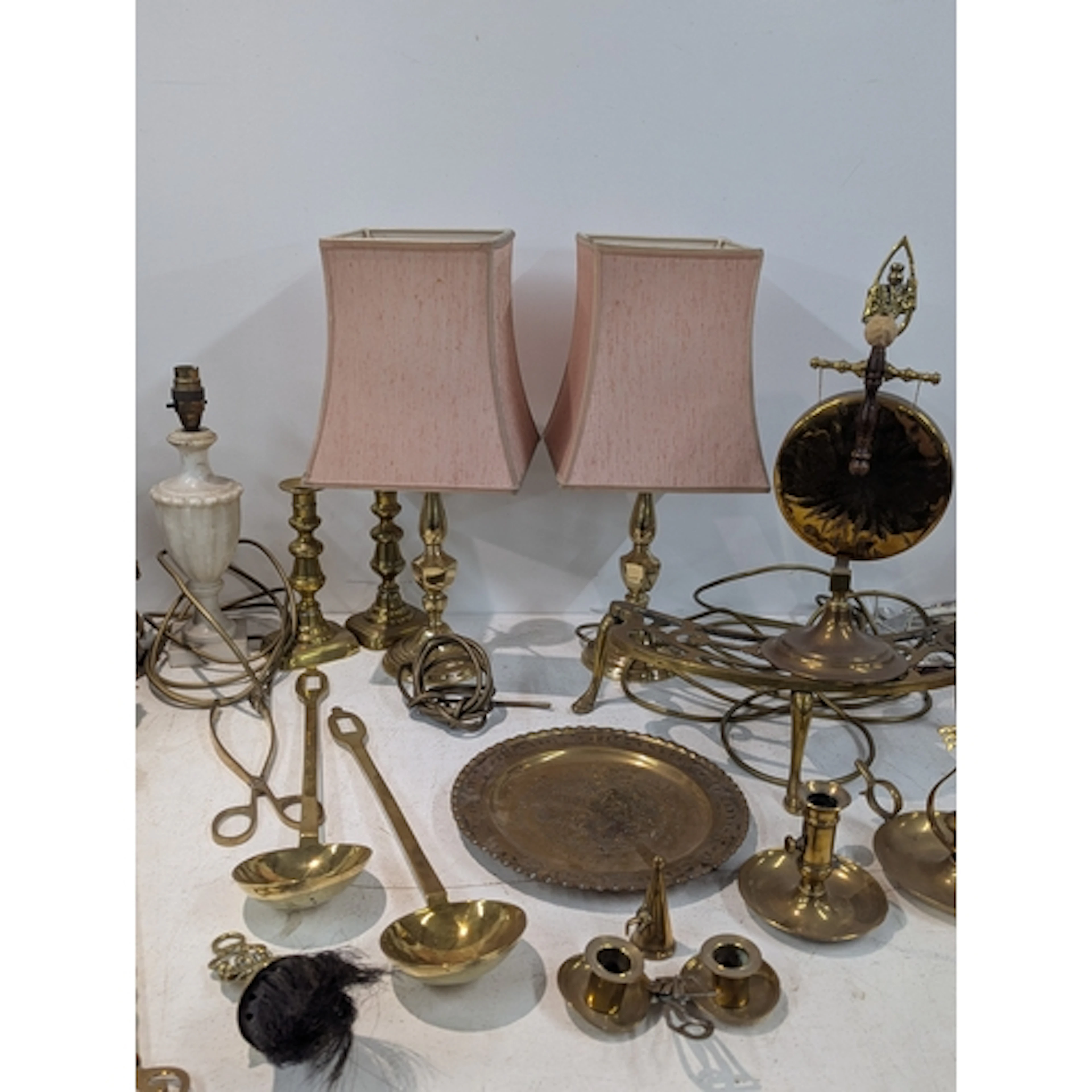 A mixed lot of brassware to include table lamps, a dinner go...