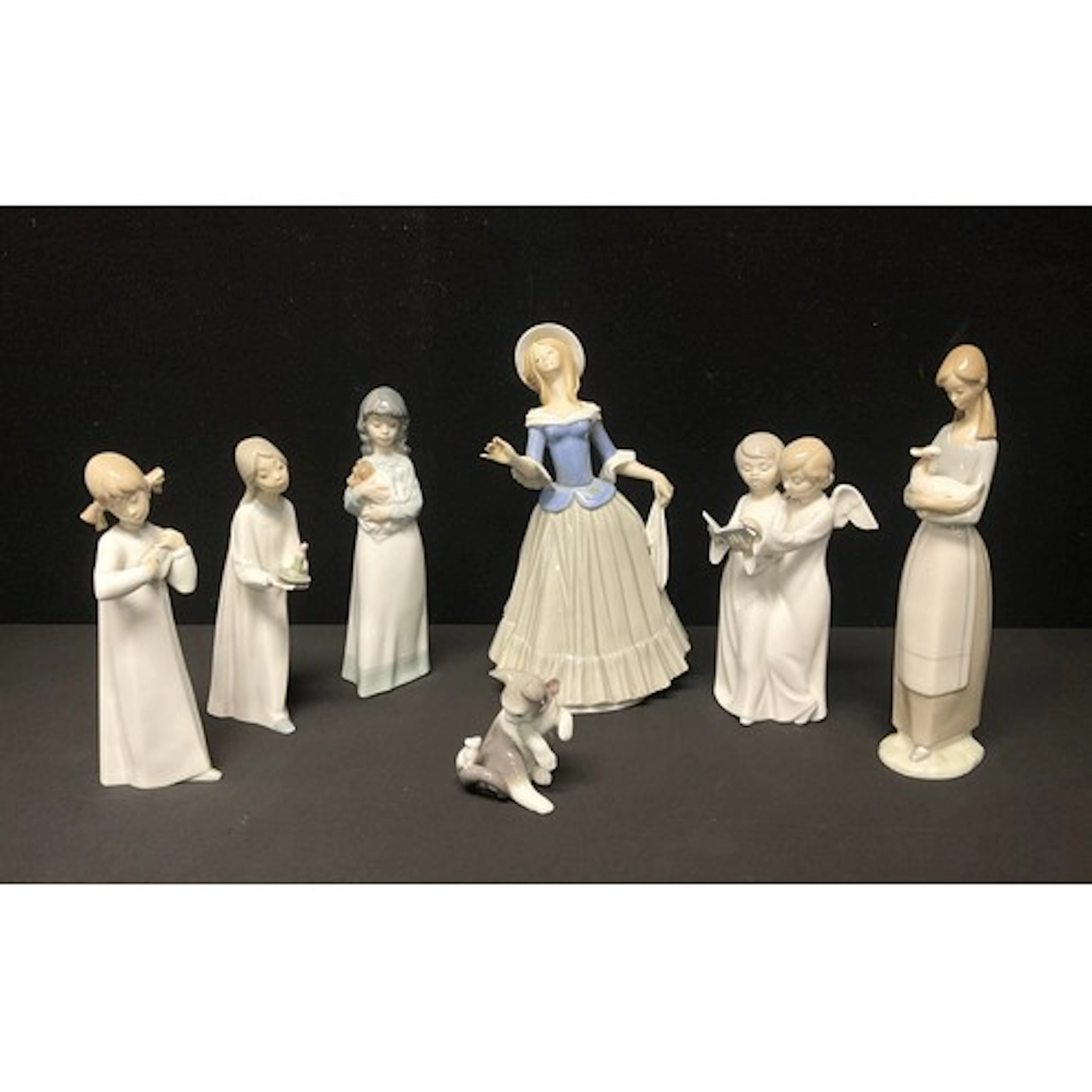 A Nao ceramic figure group, Angel Choir, 19.5cm high; others...
