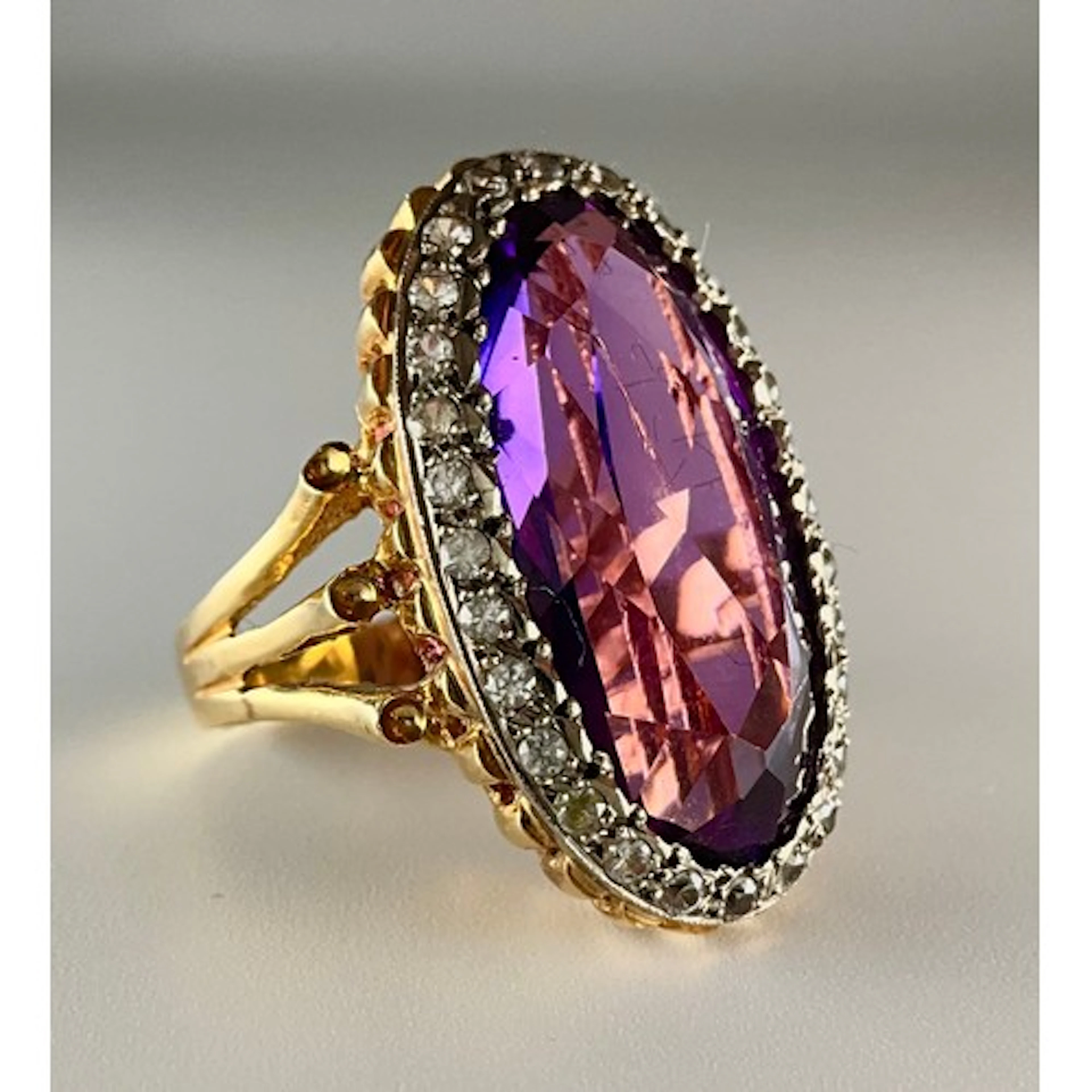 An 18ct gold synthetic colour change sapphire and cubic zirc...