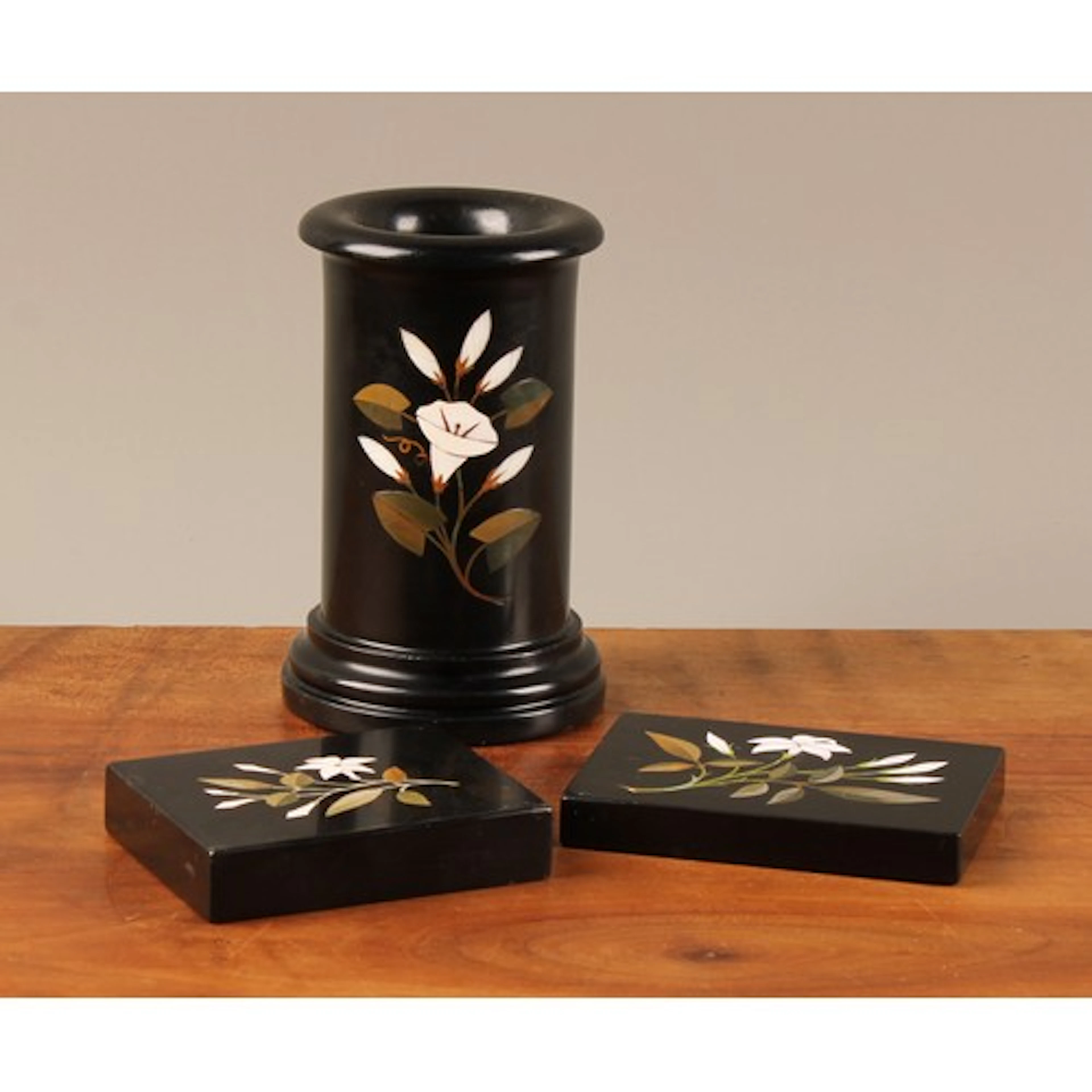 An Ashford marble composed desk suite, the spill vase inlaid...