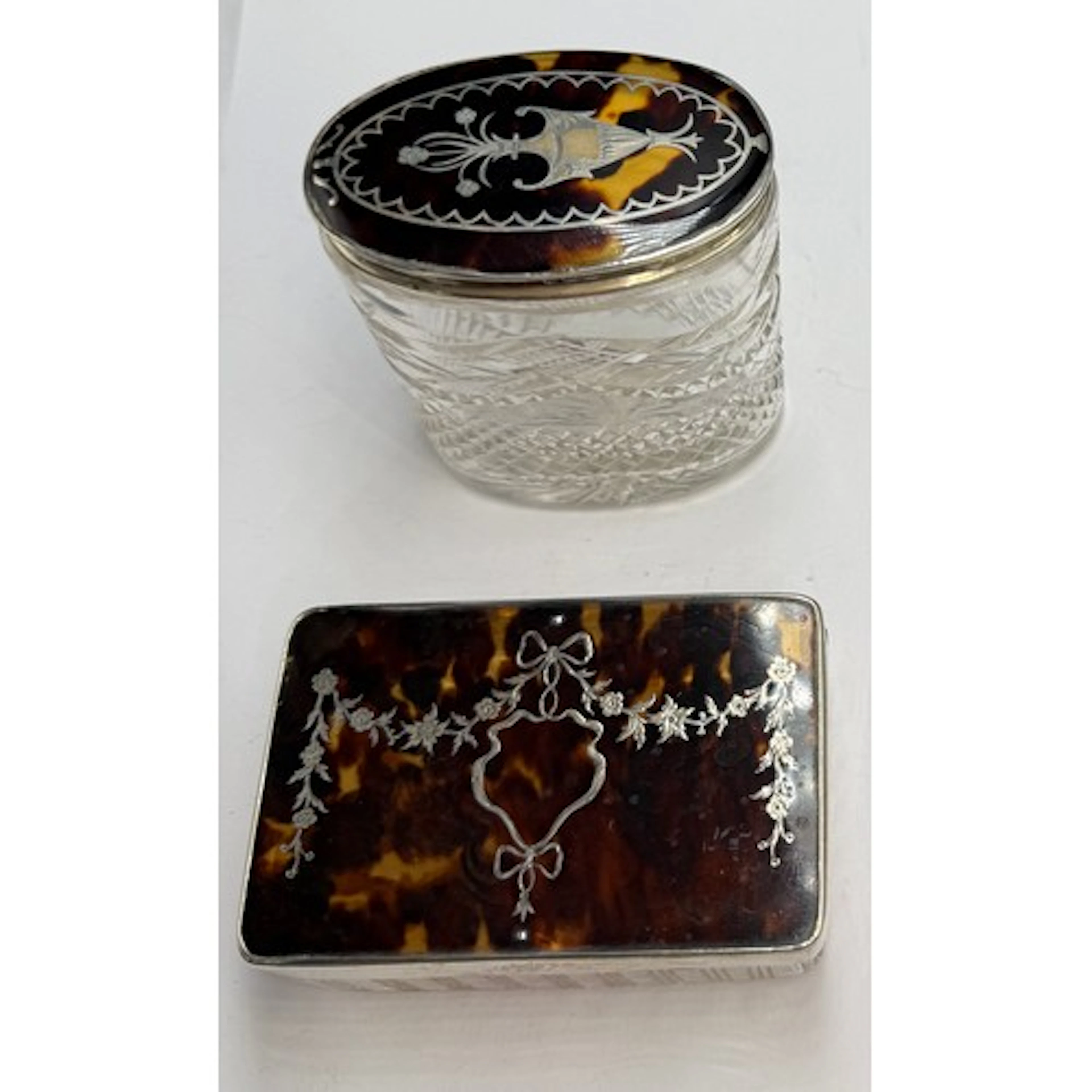 Two glass and silver tortoiseshell pique topped jars to incl...