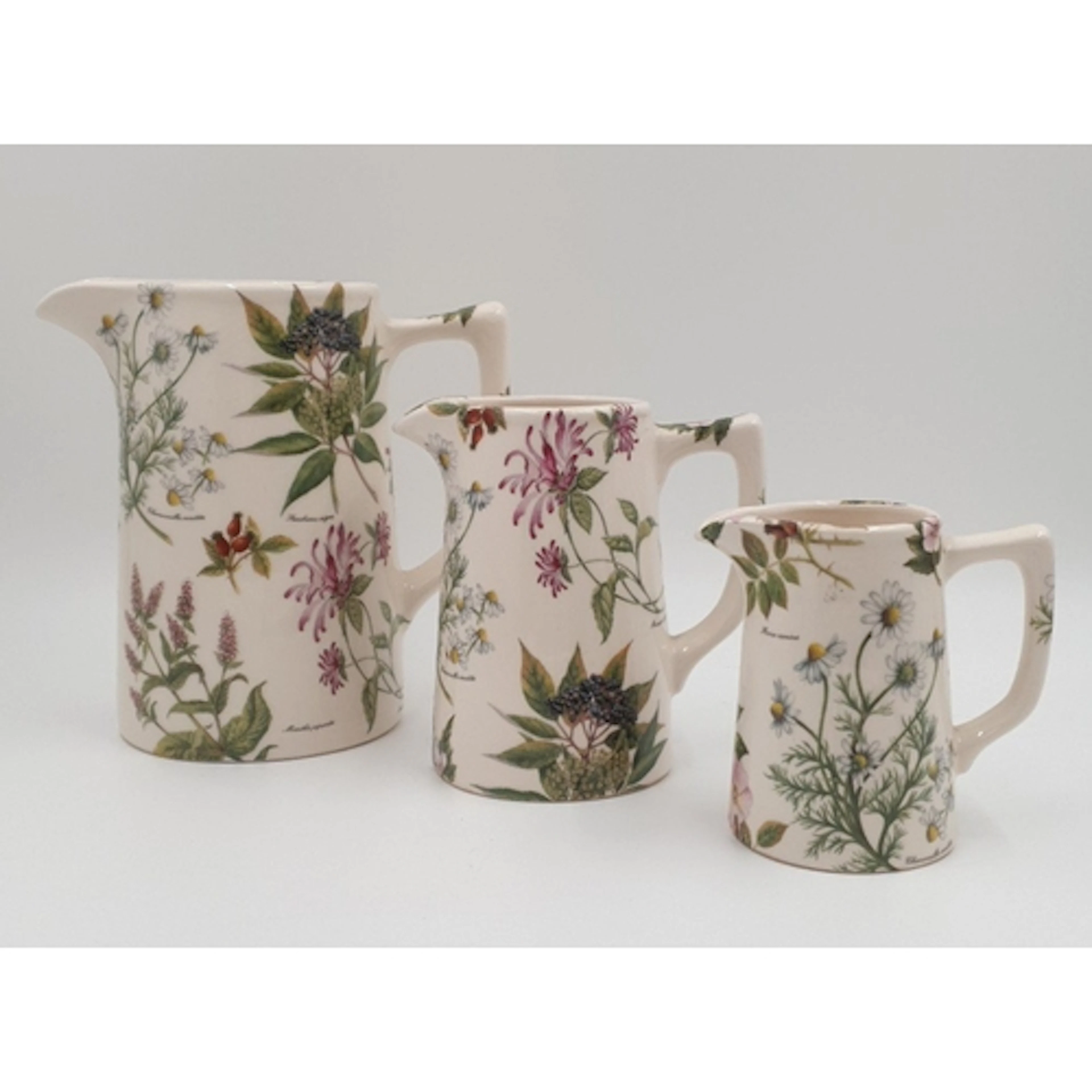 Set of three Bristol China Company ceramic jugs of graduated...