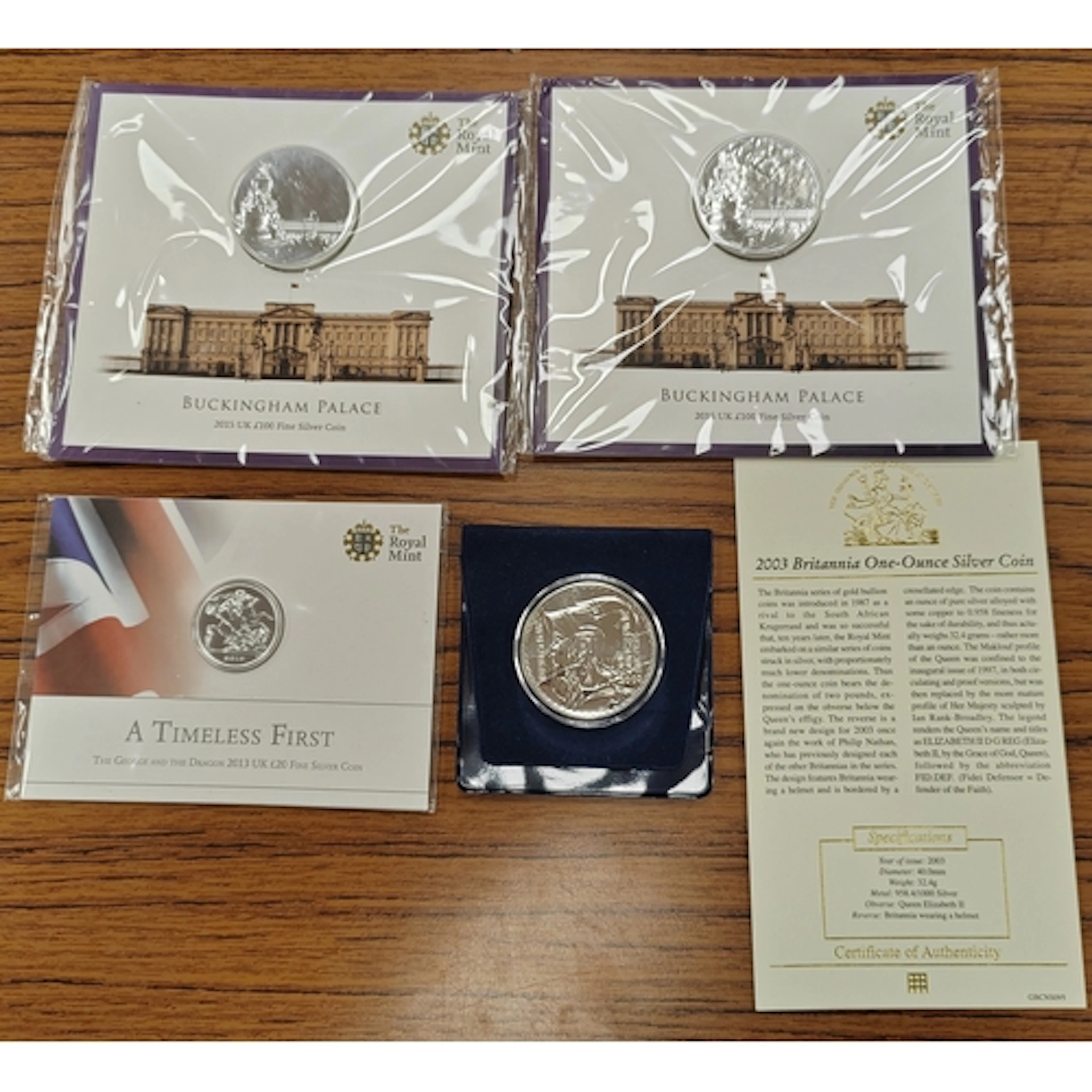 Range of uncirculated on card silver coins, includes 2013 £2...