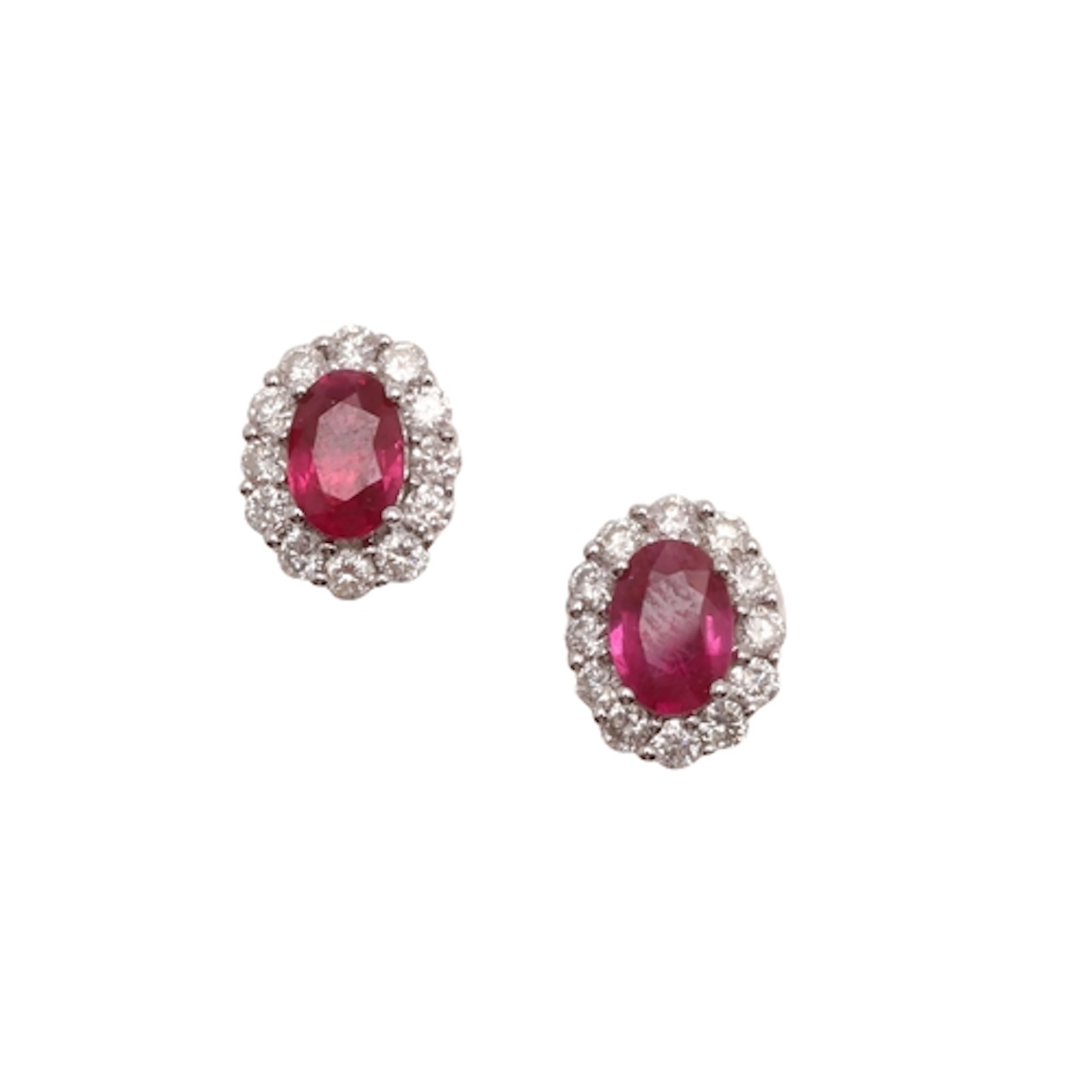 A PAIR OF RUBY AND DIAMOND CLUSTER STUD EARRINGS. each earri...