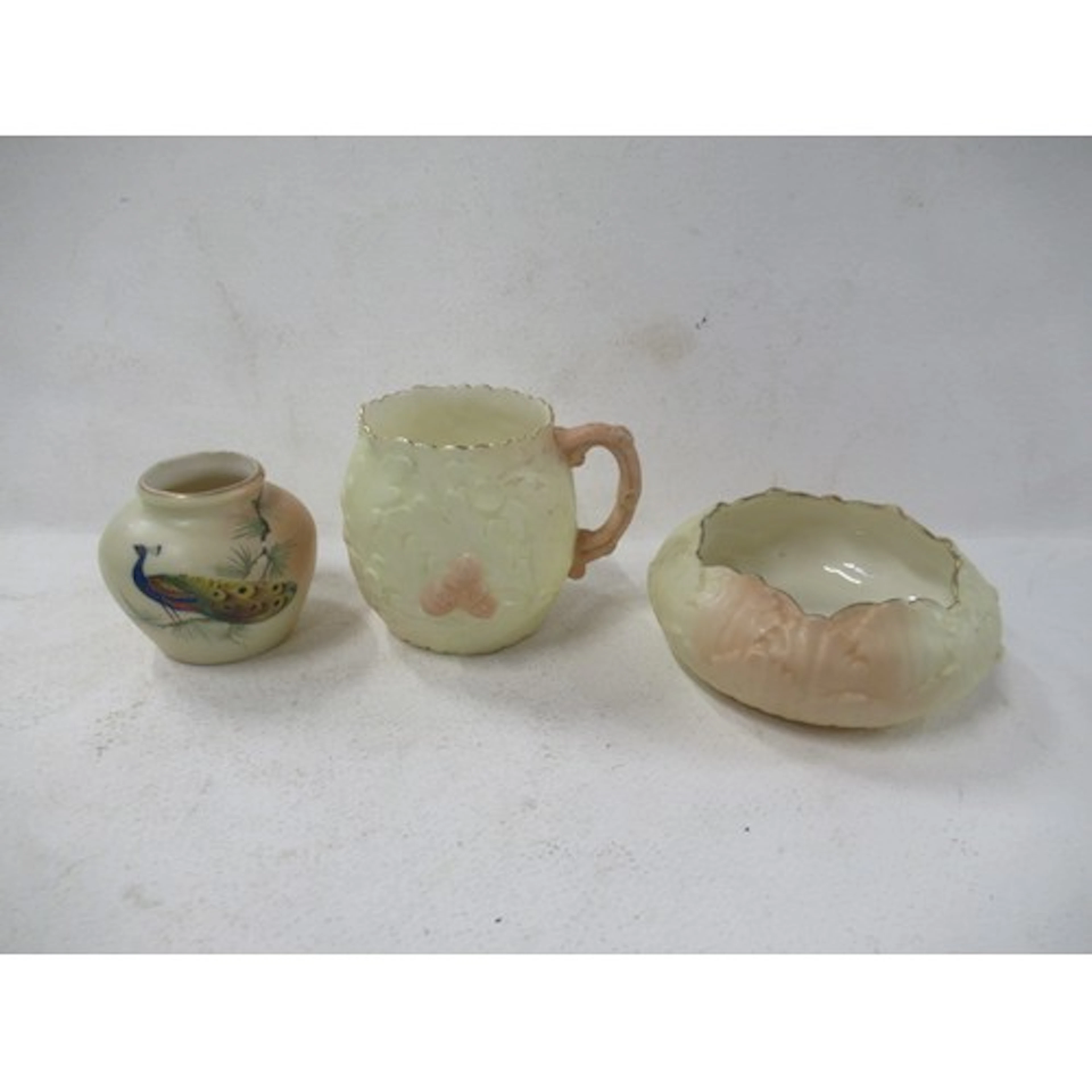 A Locke & Co Worcester blush ivory vase, decorated with a pe...
