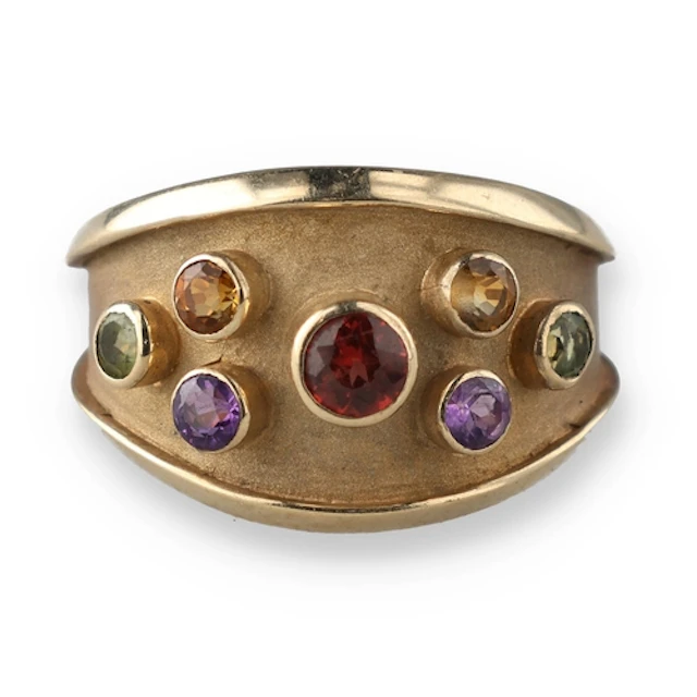 A 9CT GOLD MULTI-STONE RING