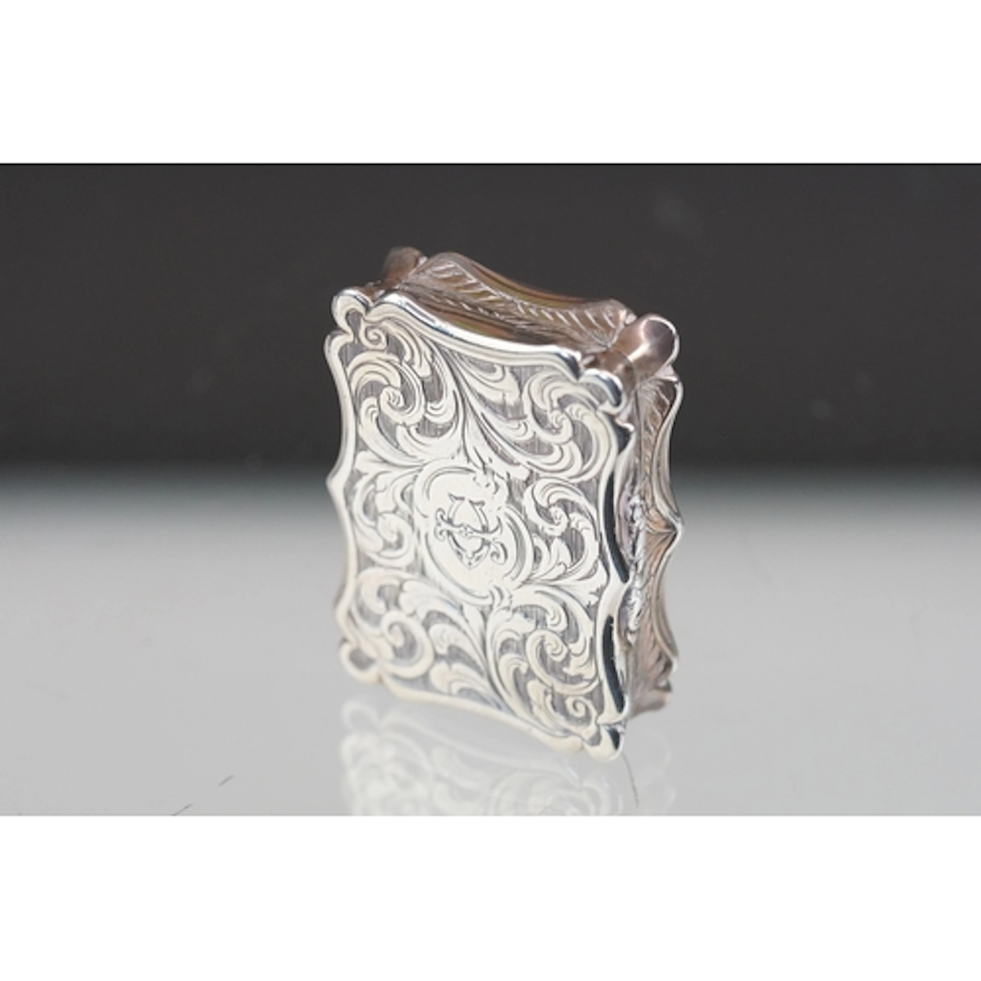 Victorian silver foliate engraved vinaigrette, the central c...