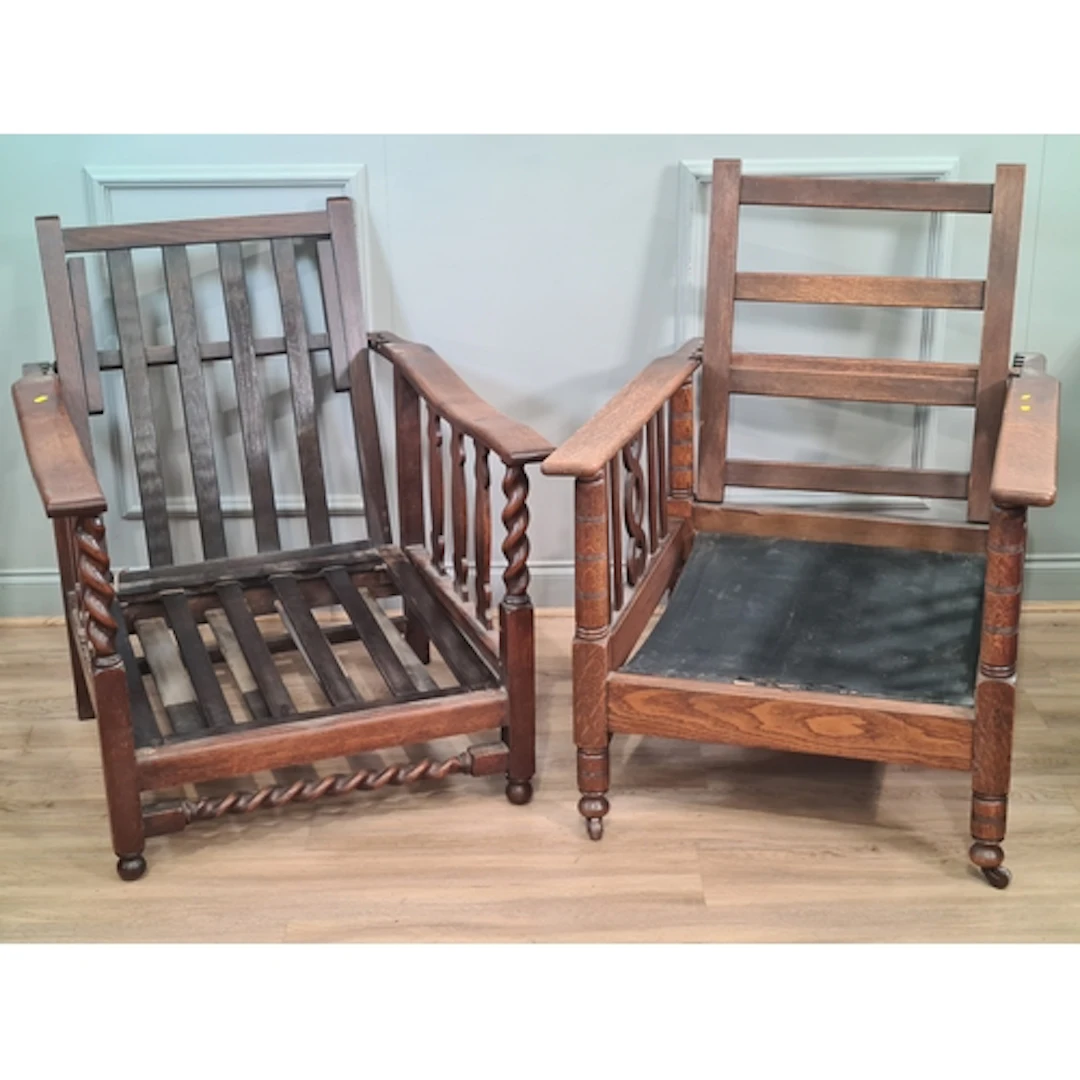 A near pair of reclining wooden framed Armchairs, (R2).