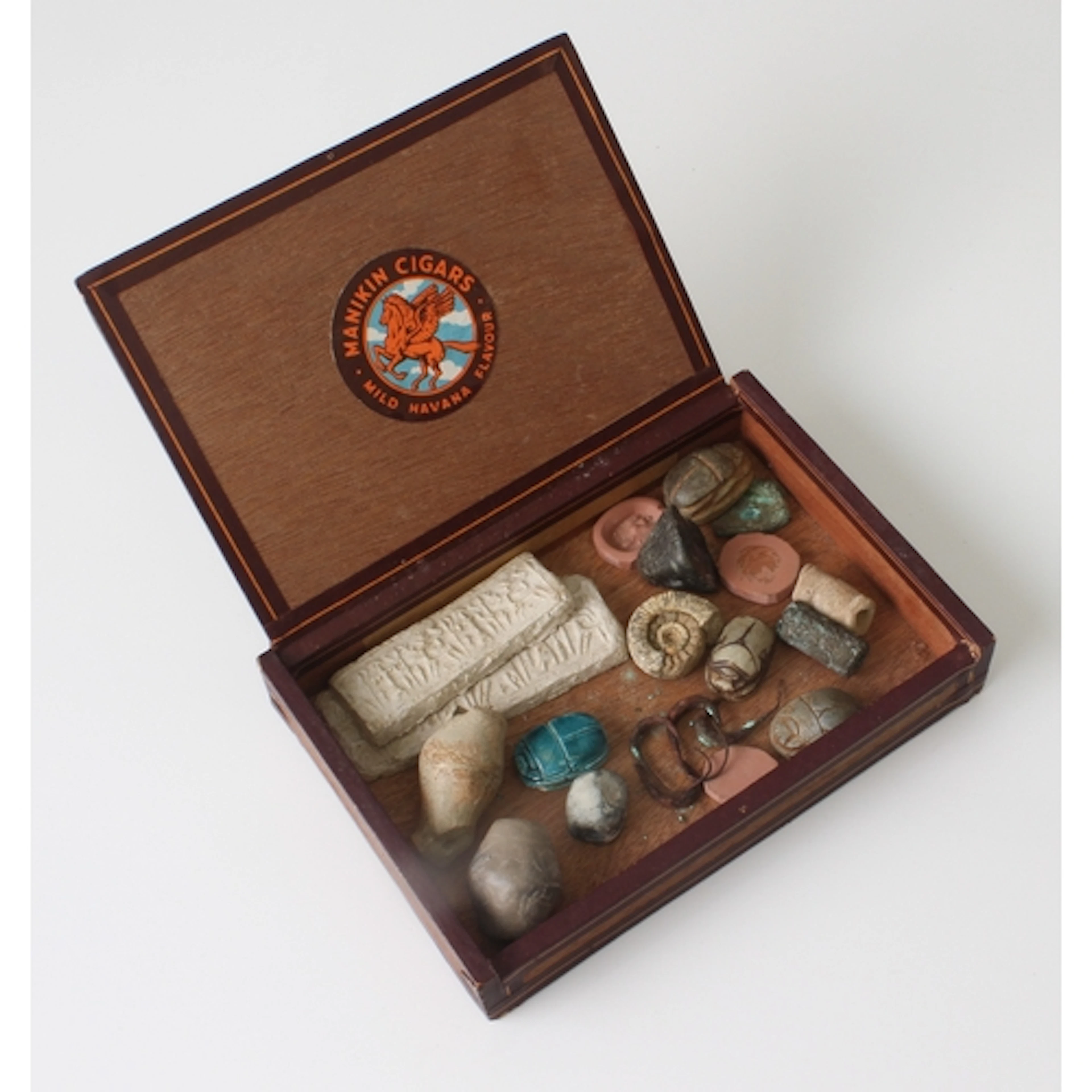 A small cigar box containing a group of antiquities - includ...