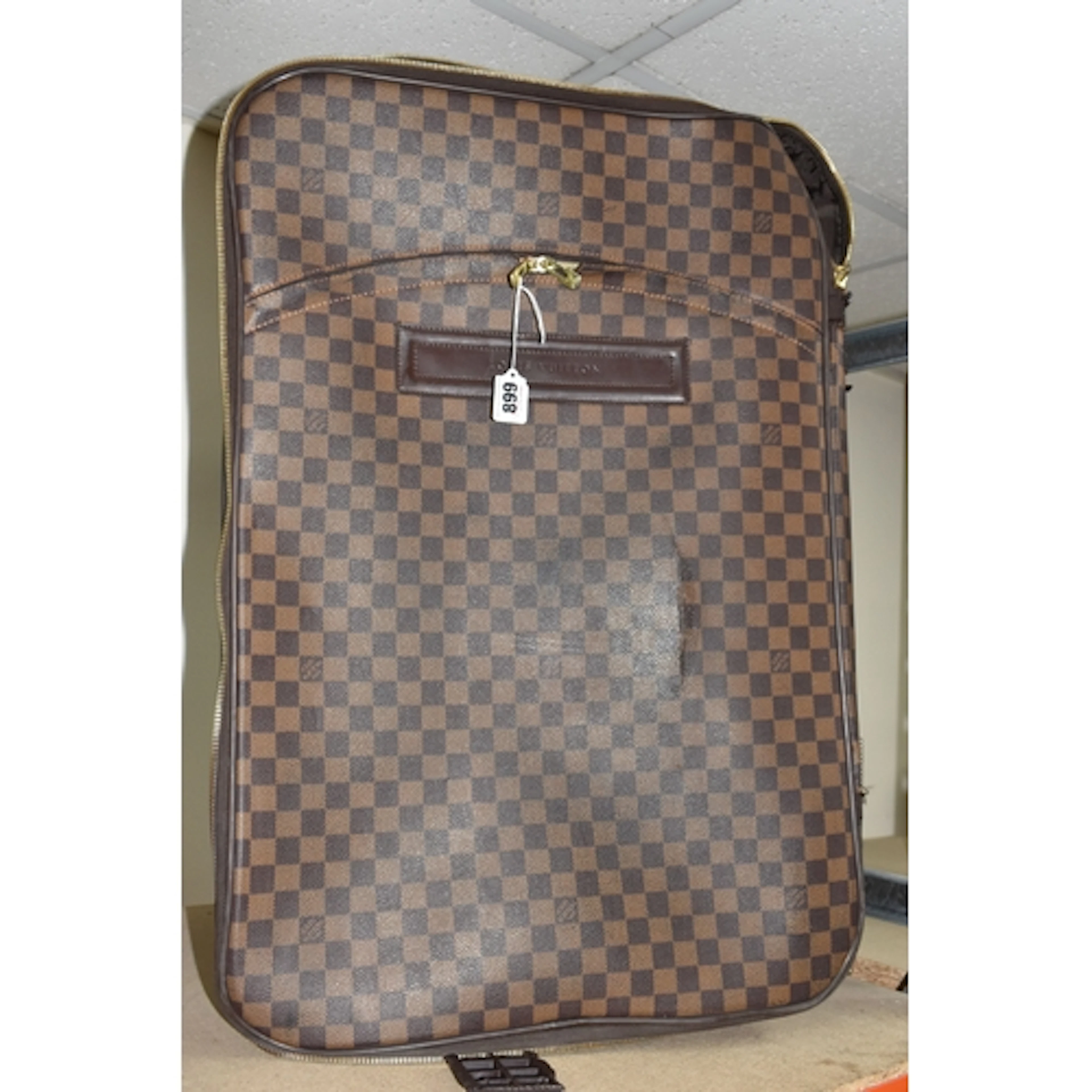 A LOUIS VUITTON PAGASE 65 SUITCASE, crafted in damier ebene ...