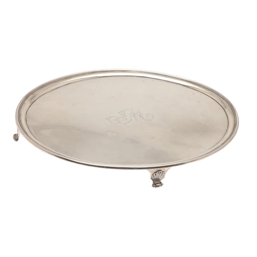 A GEORGE III SCOTTISH SILVER WAITER. Of plain oval shape wit...