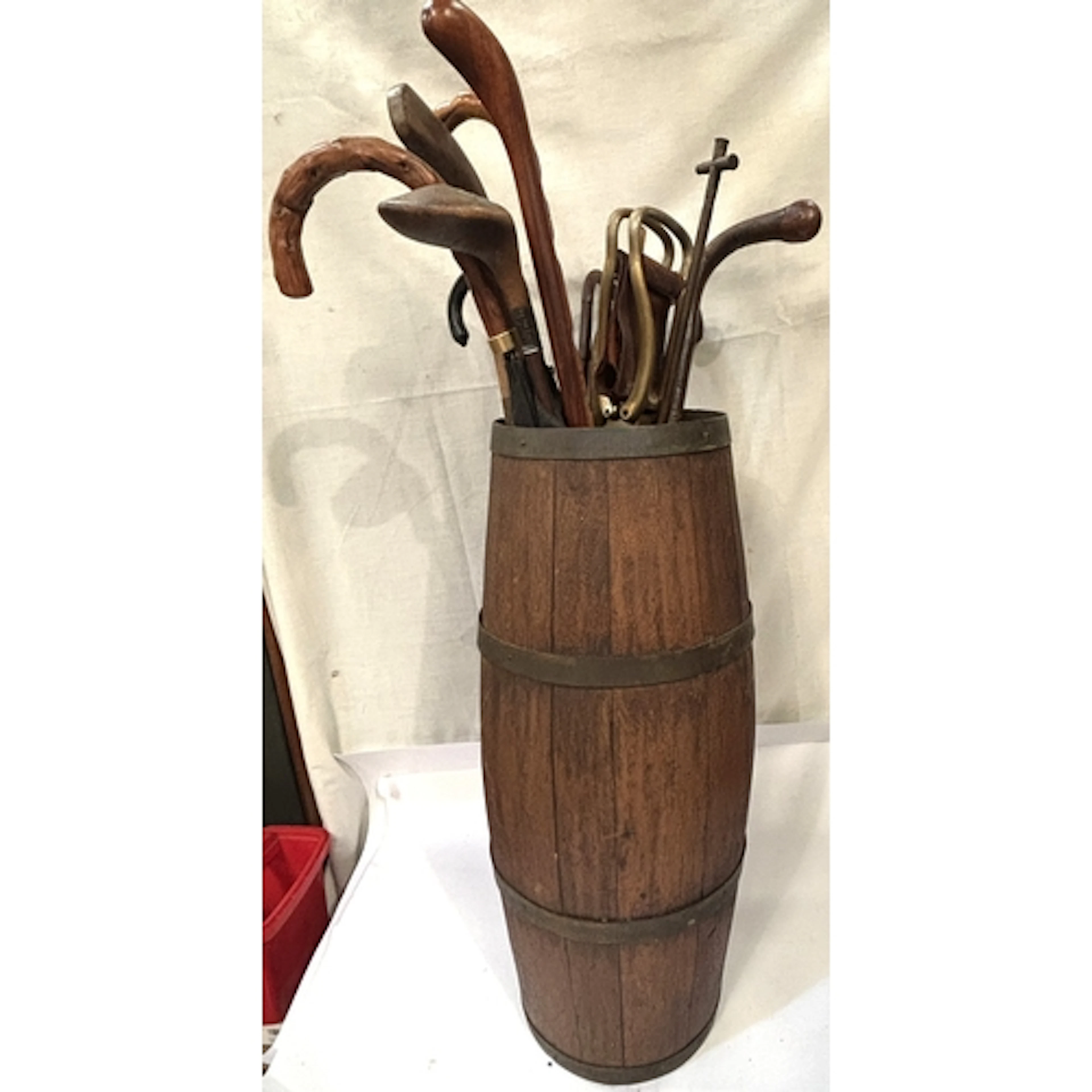 A 19th century brass bound barrel stick stand with contents,...