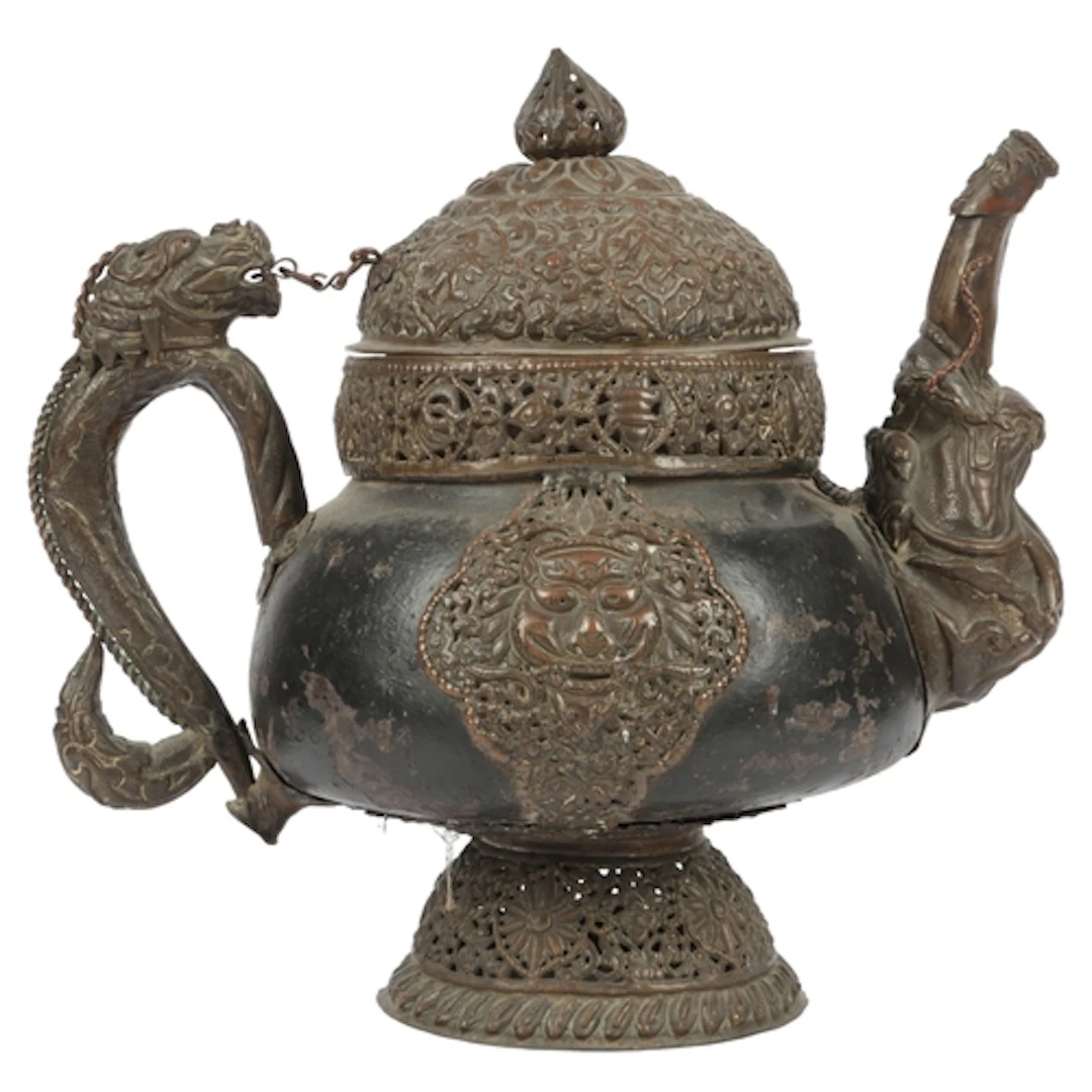 An unusual Himalayan steatite bodied, copper repoussé mounte...