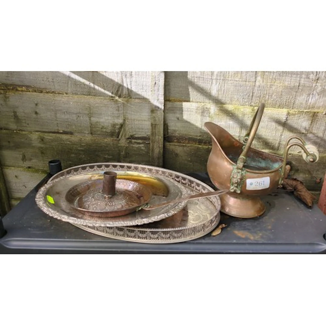 A group of decorative metalware comprising a copper coal scu...