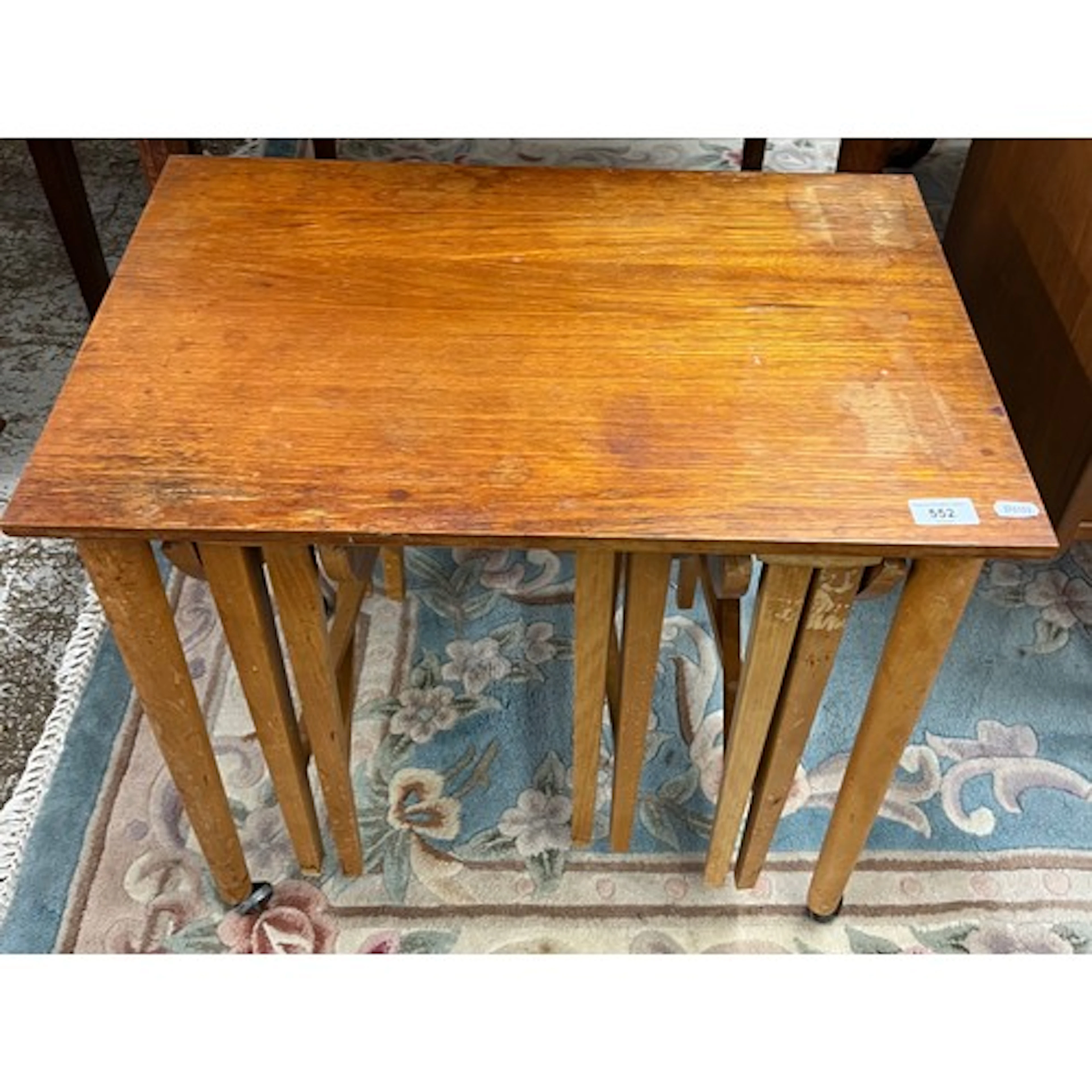 Teak nest of three folding tables.