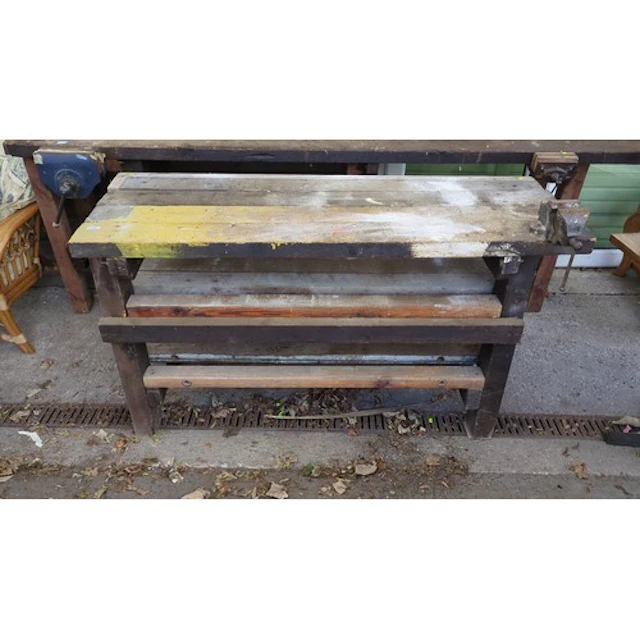 Timber workbench with a plank top, lower storage shelves and...