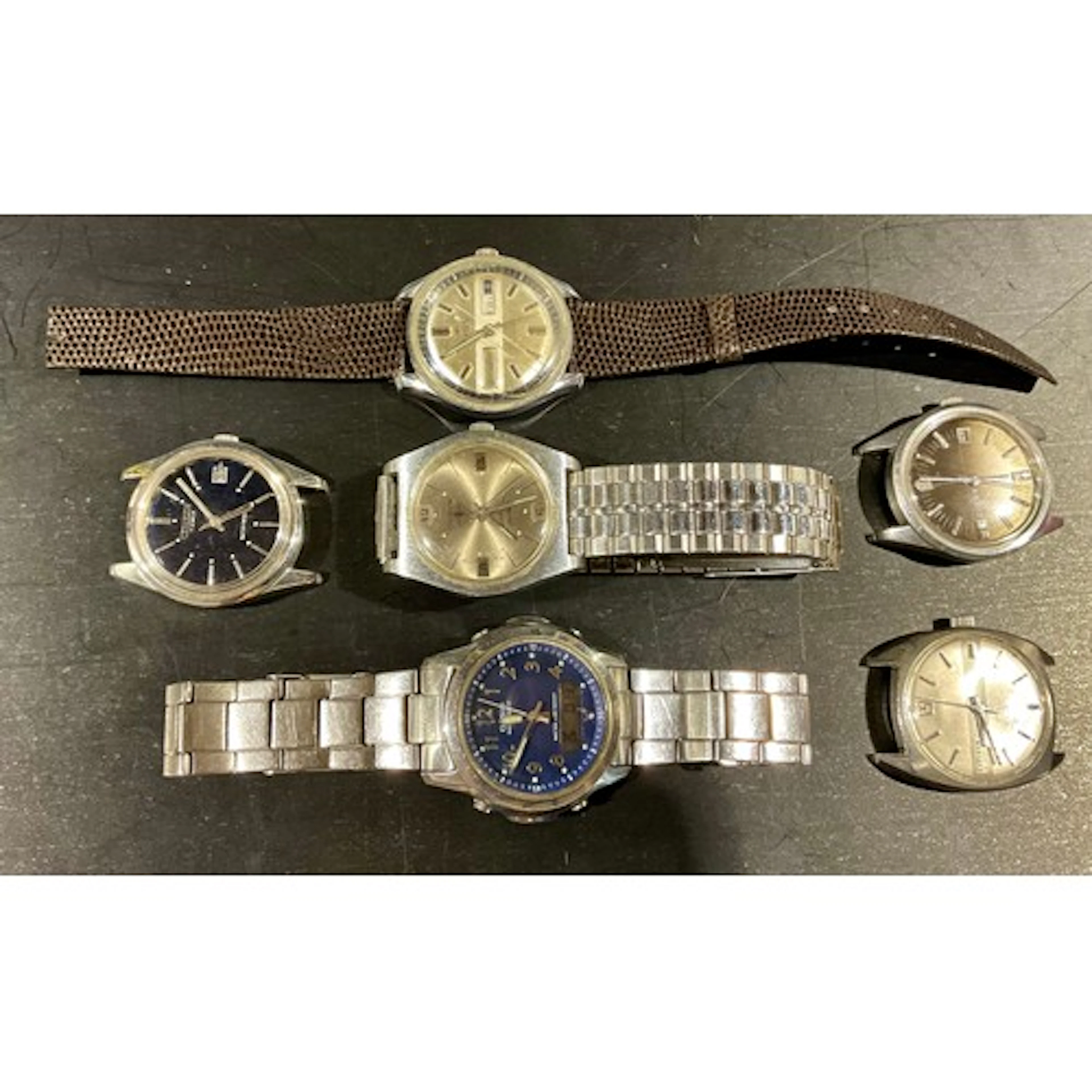 A selection of wristwatches and watch faces the three wristw...