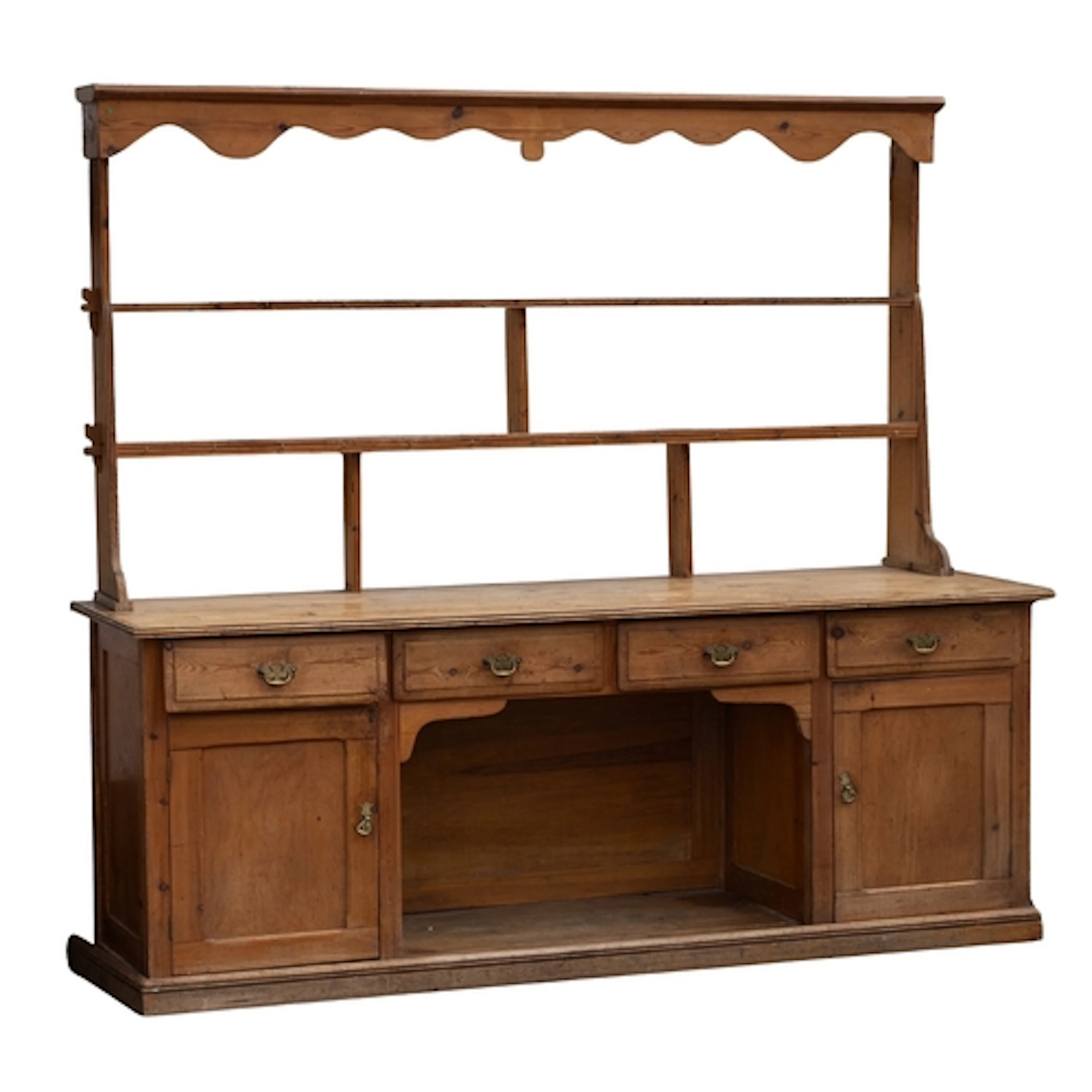 A pine kitchen dresser in 19th century style, 20th; the plat...