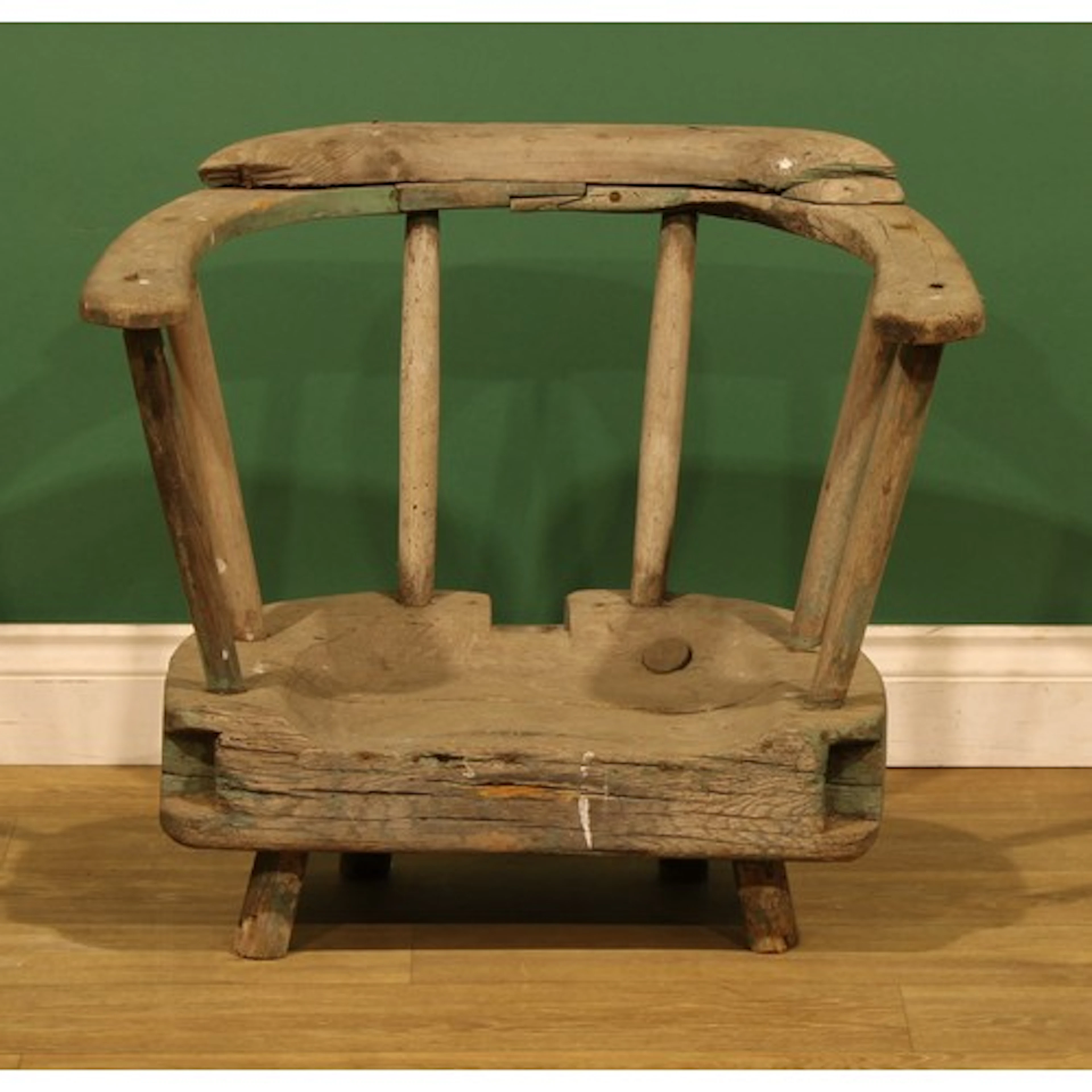 A 19th century primitive oak and ash yoke-back stick chair, ...