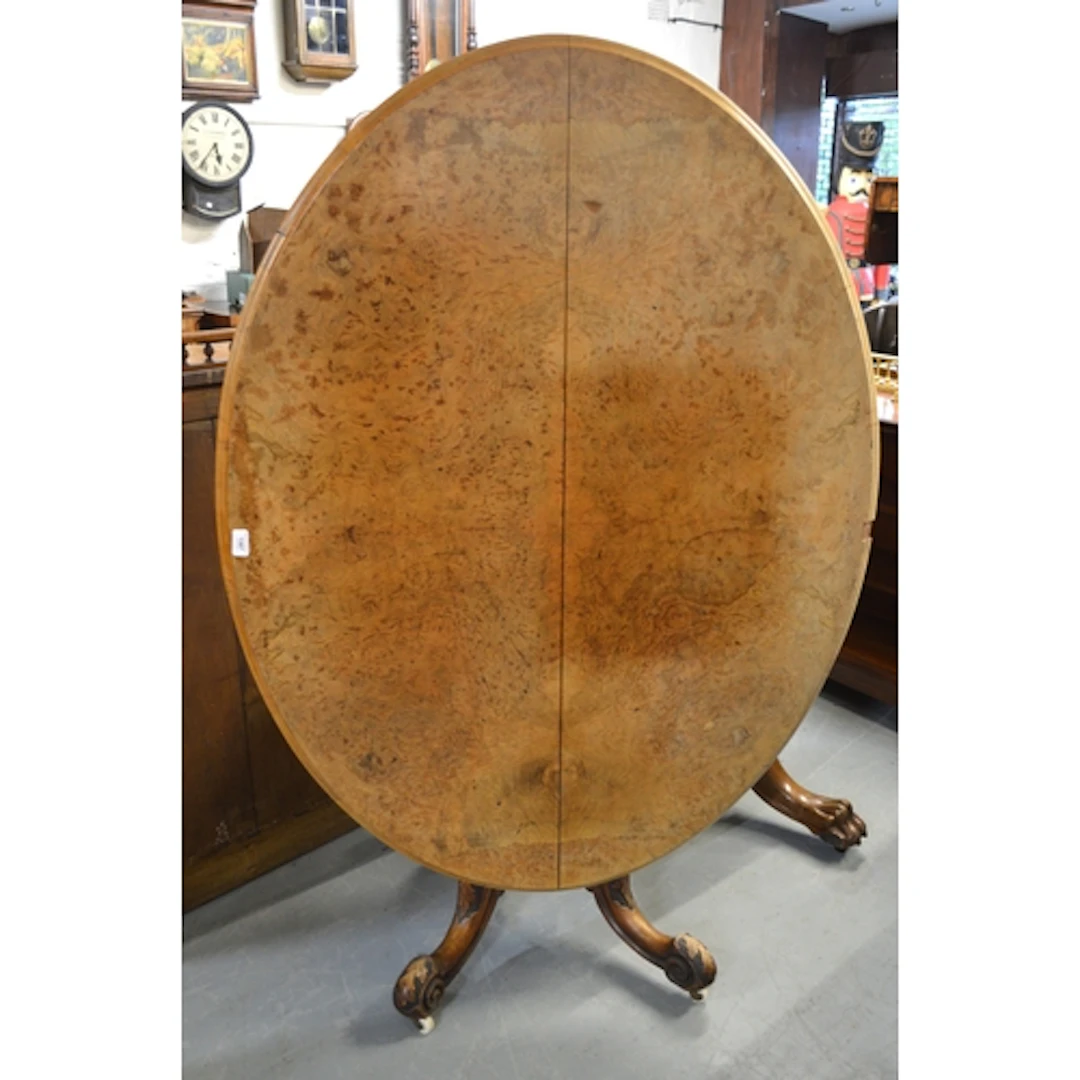Victorian figured walnut oval centre table, on a turned and ...