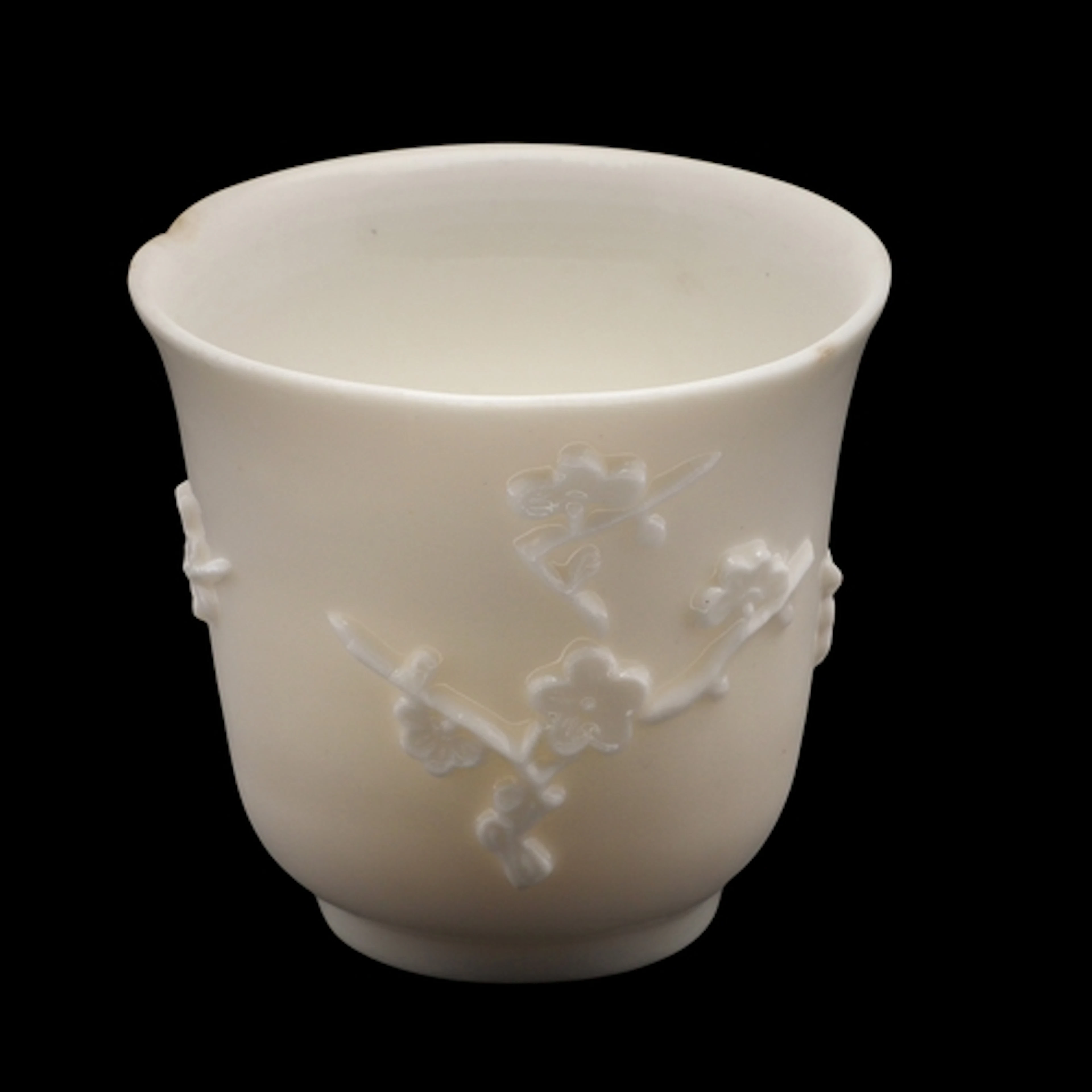 A CHINESE DEHUA 'PRUNUS' LIBATION CUP, QING DYNASTY, KANGXI ...