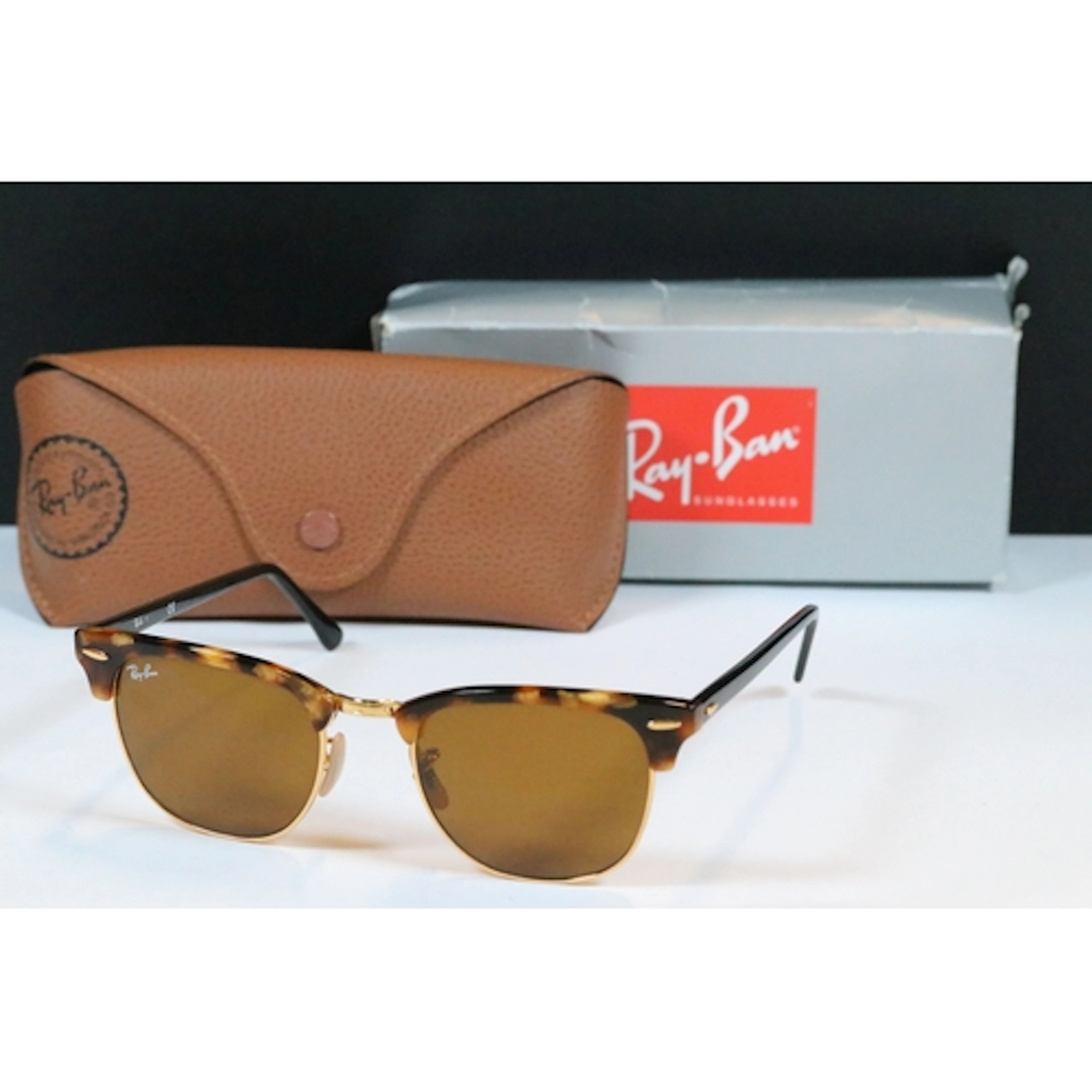 Pair of Ray Ban Clubmaster sunglasses in tortoise shell/blac...