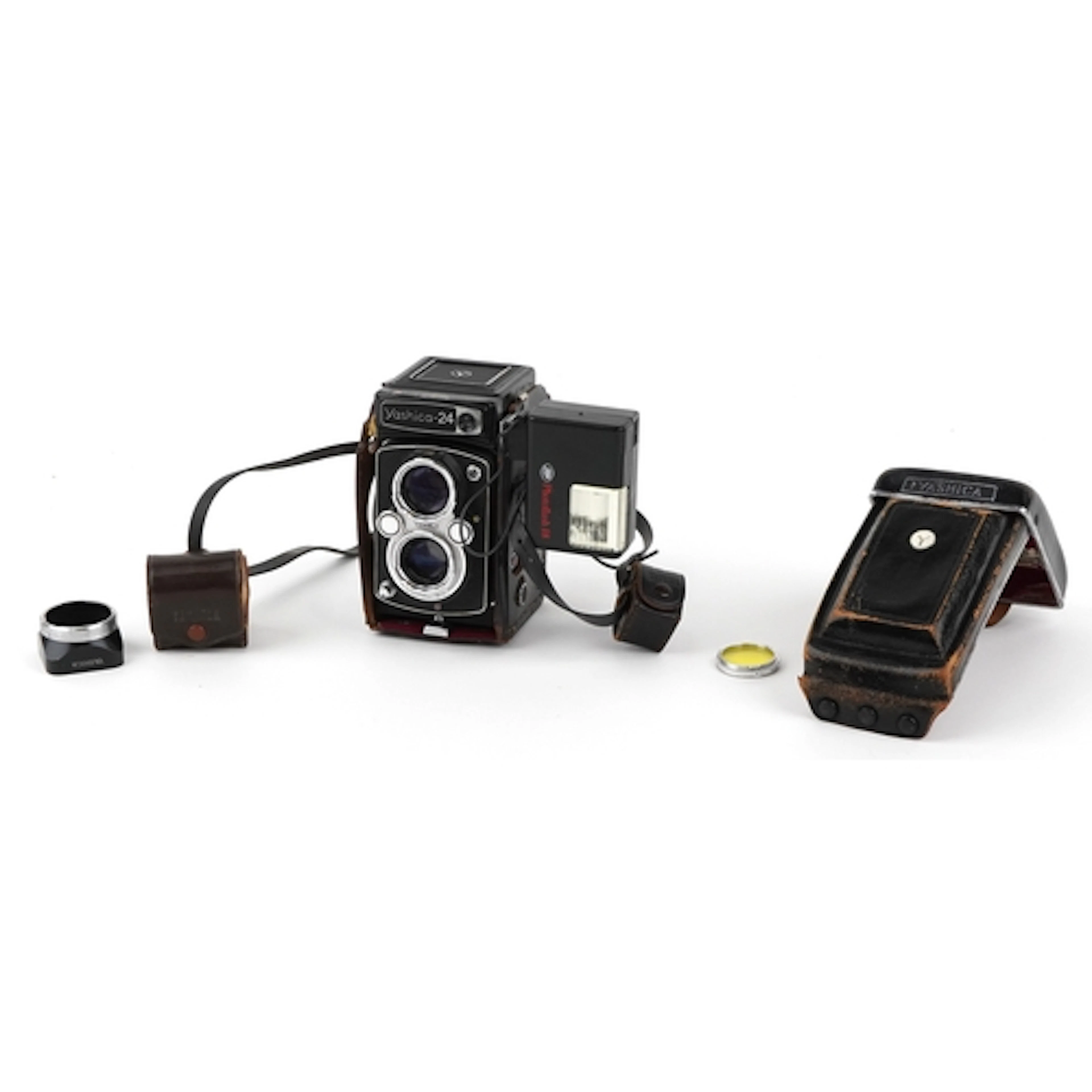 Vintage Yashica 24 camera with leather case and flash unit.