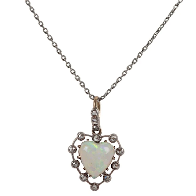 An opal and diamond pendant, early 20th century, claw-set wi...