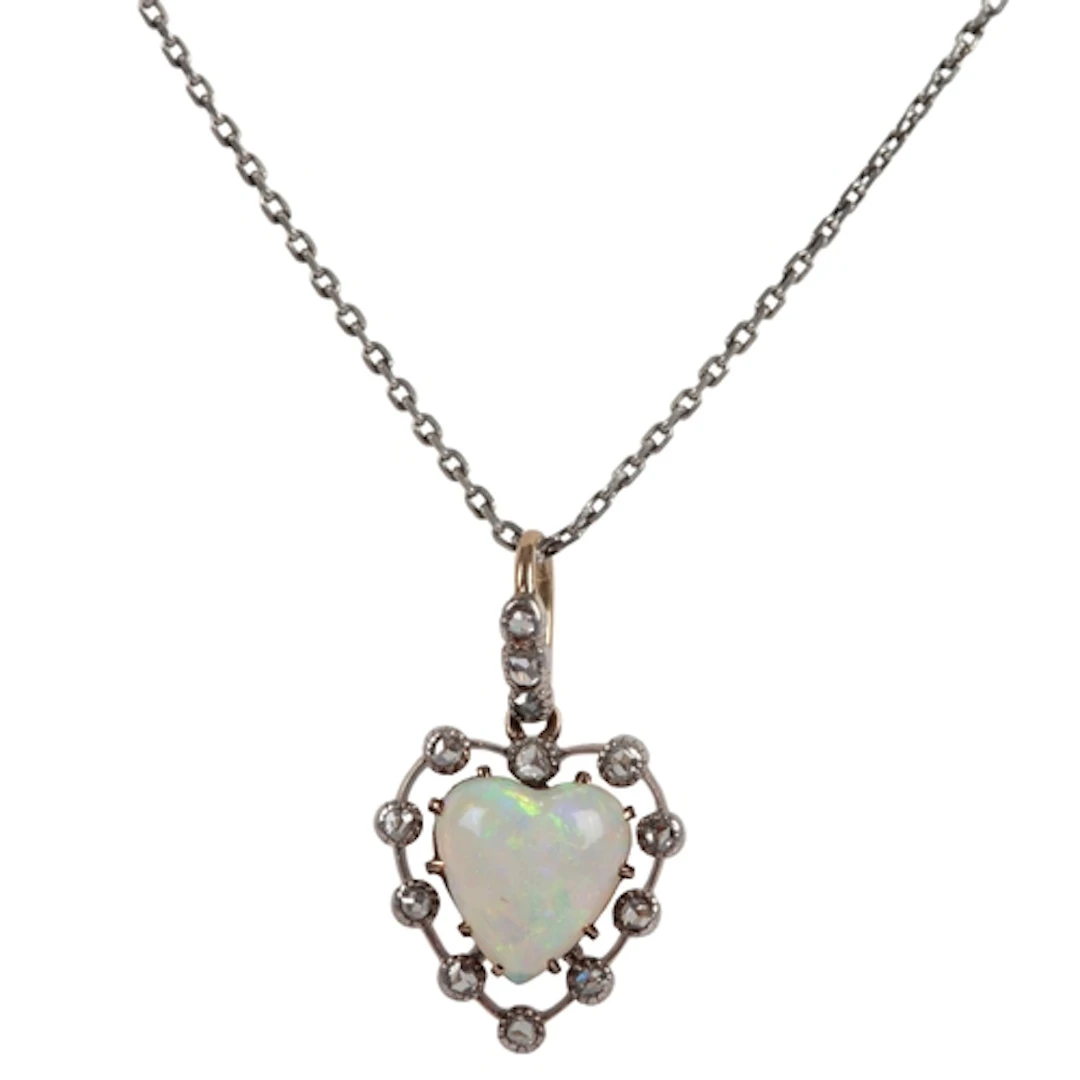 An opal and diamond pendant, early 20th century, claw-set wi...