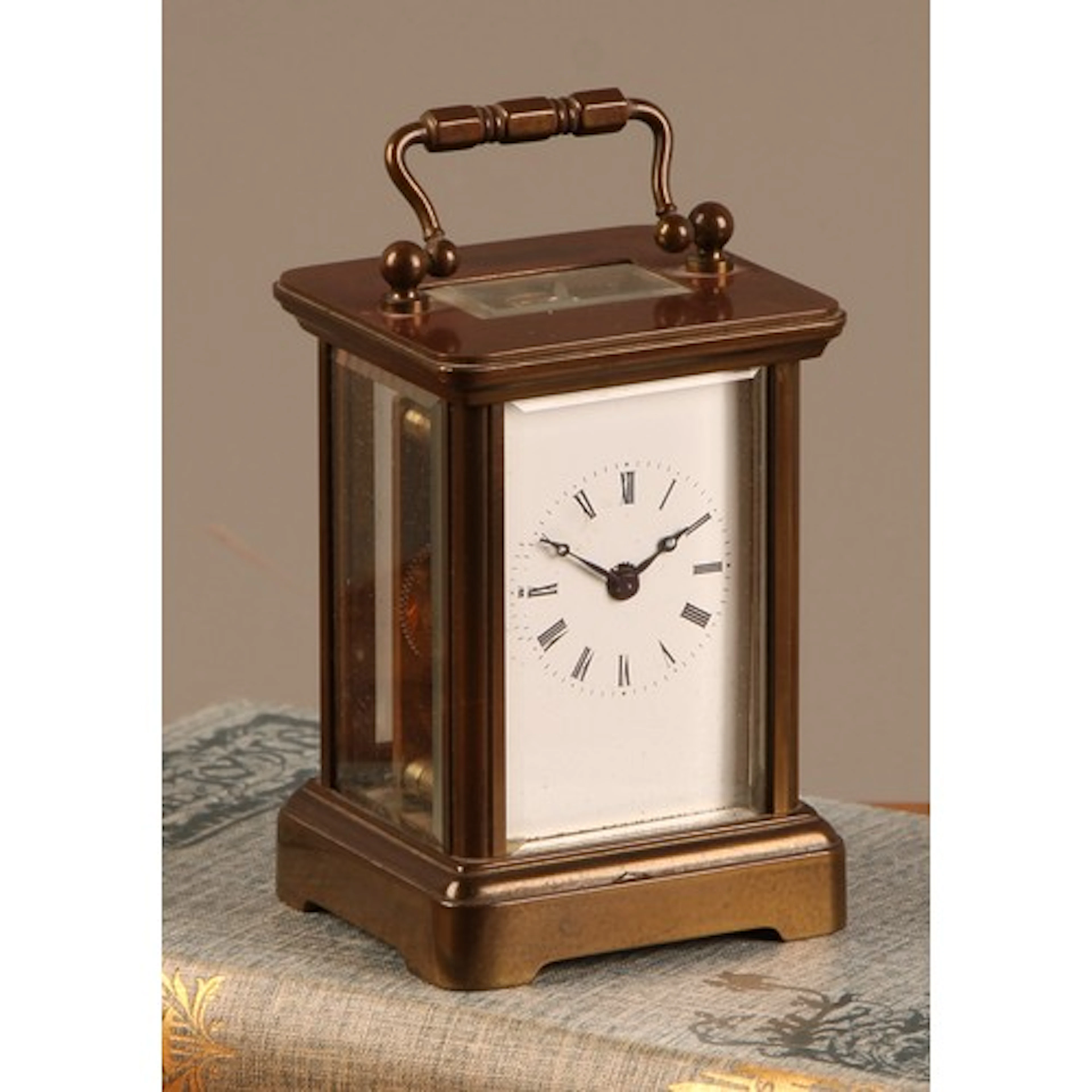 An early 20th century lacquered brass miniature carriage tim...
