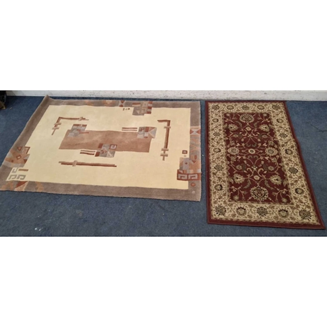 TWO RECTANGULAR RUGS, the larger rug with geometric patterns...