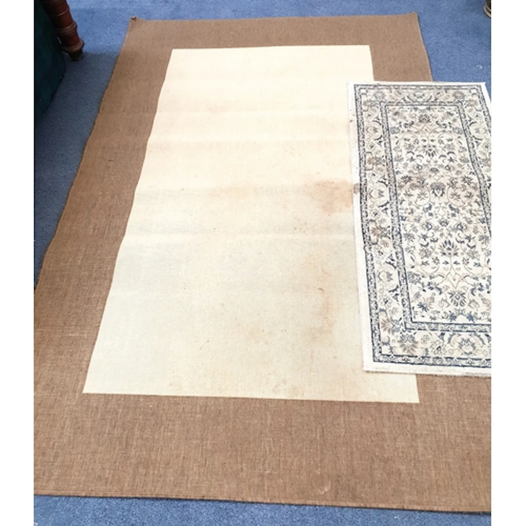 TWO FLOOR RUGS the smaller runner style example in shades of...