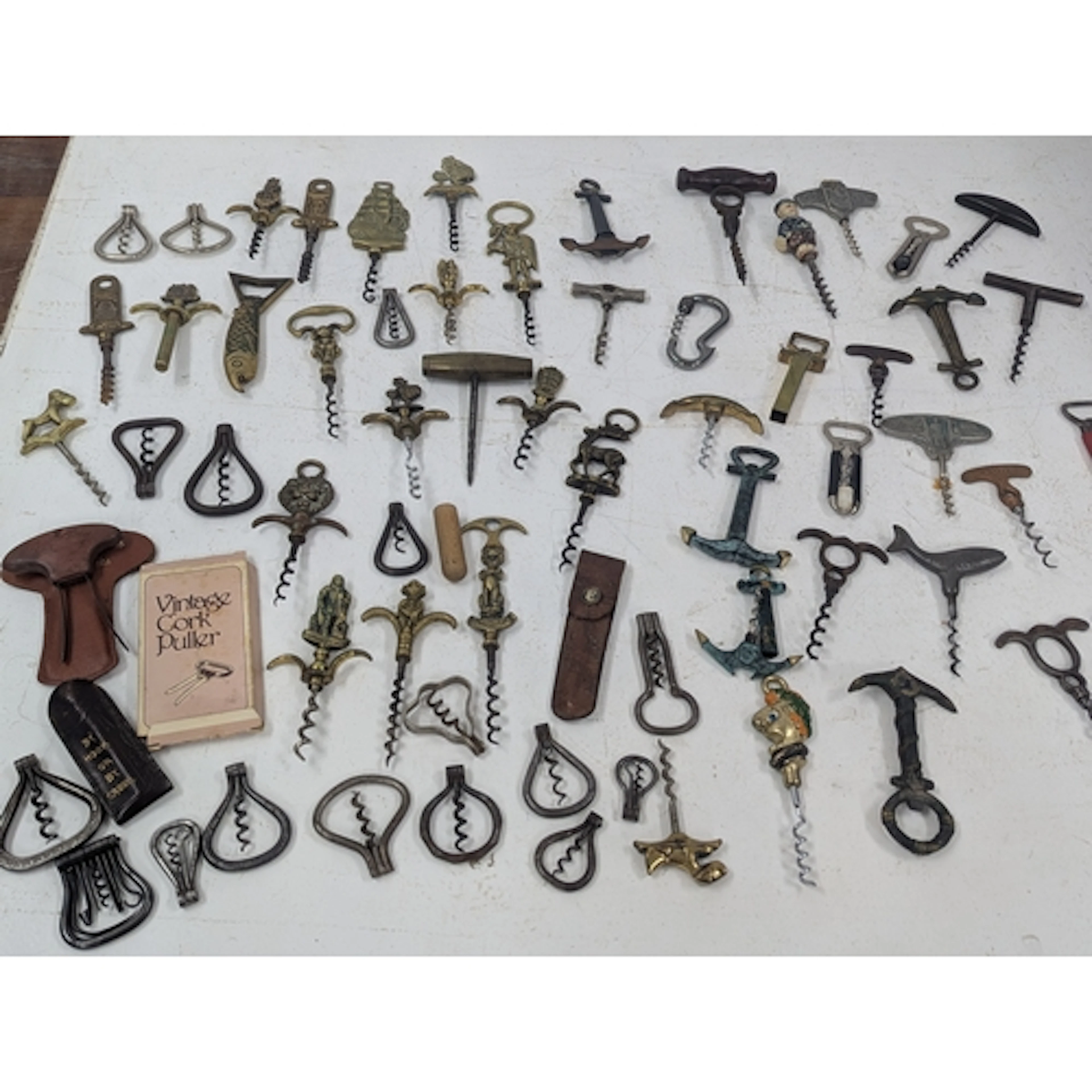 An assortment of vintage cork screws, to include examples fa...