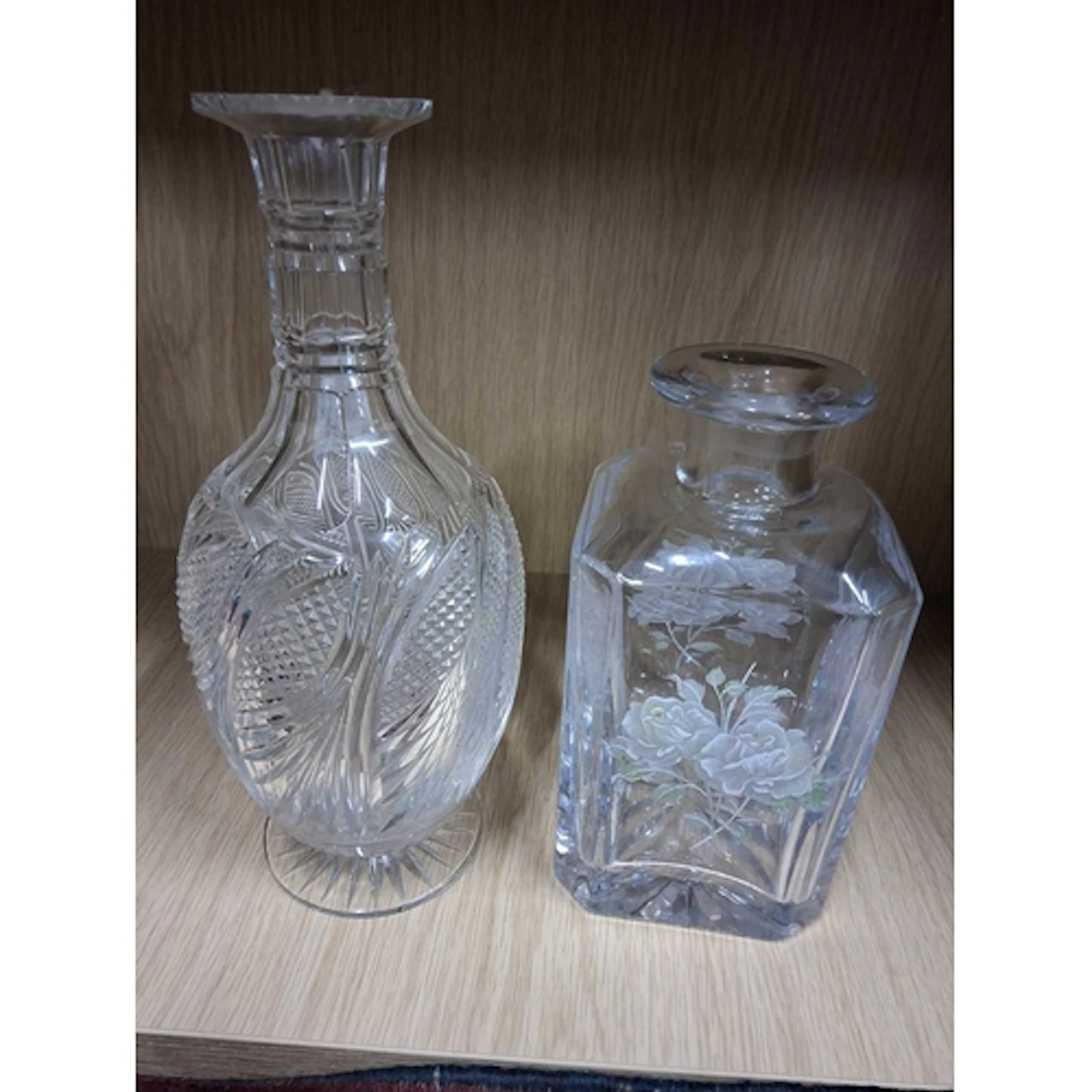 TWO GLASS DECANTERS, comprising a round cut glass decanter o...