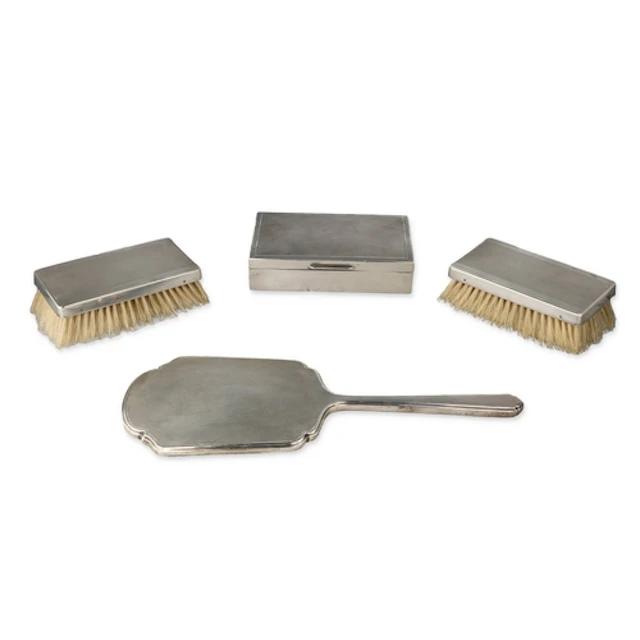 A PAIR OF ART DECO SILVER ENGINE TURNED MILITARY HAIR BRUSHE...