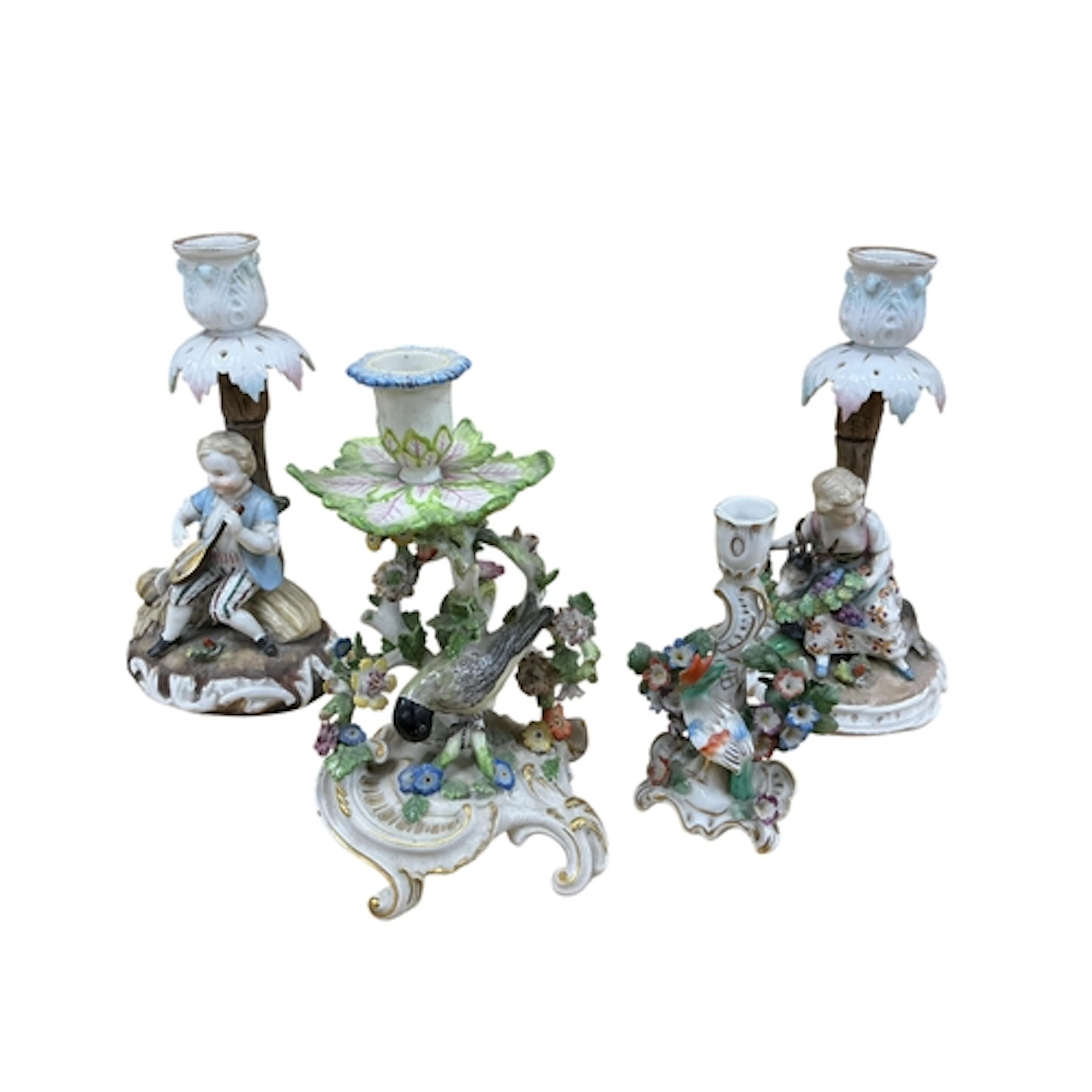 Four Continental porcelain figural candlesticks, late 19th c...